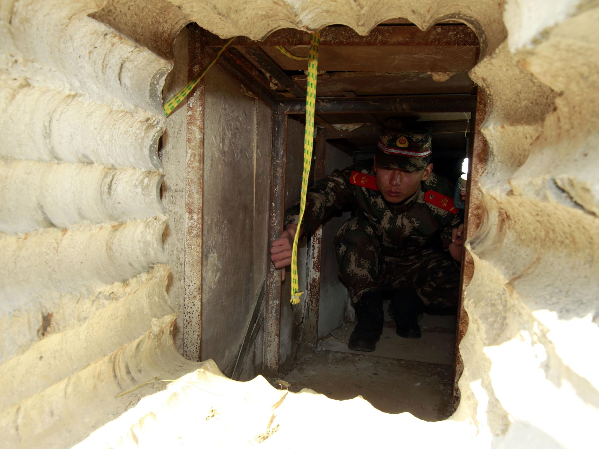 A soldier checking an underground tunnel leading to Hong Kong from Shenzhen, south China's Guangdong province.