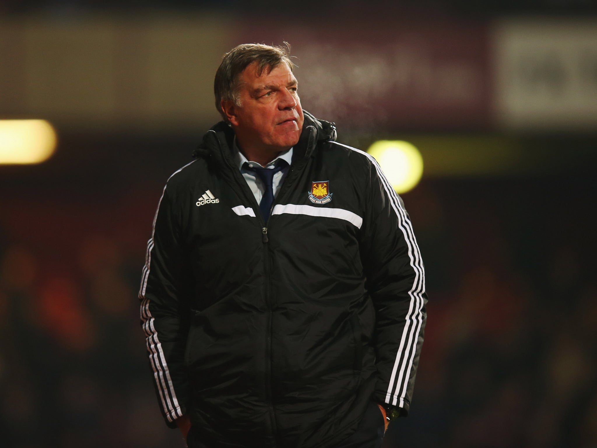 West Ham manager Sam Allardyce looks despondent after his side were beaten 3-1 by Arsenal.