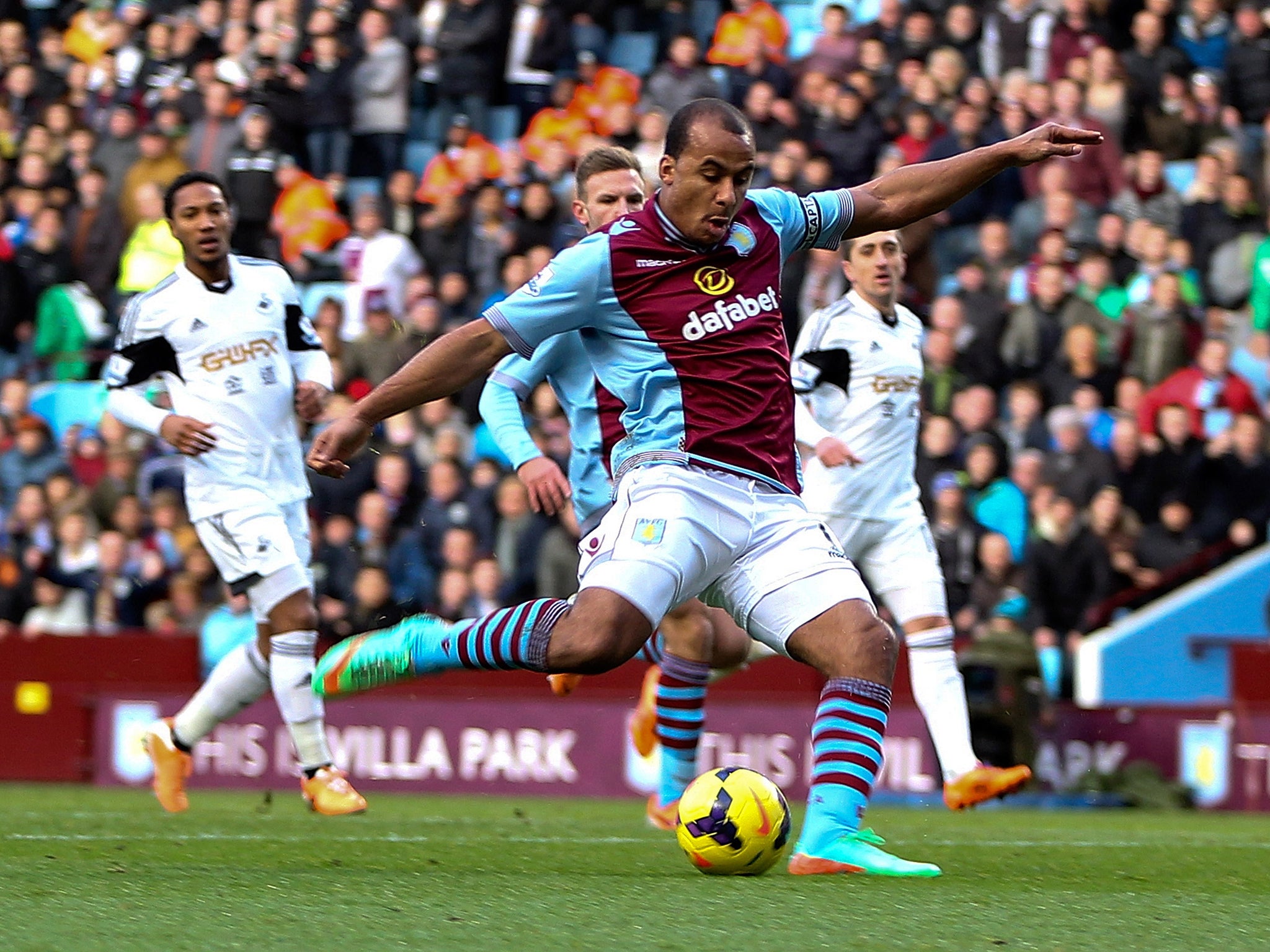 Aston Villa striker Gabriel Agbonlahor scores against Swansea City