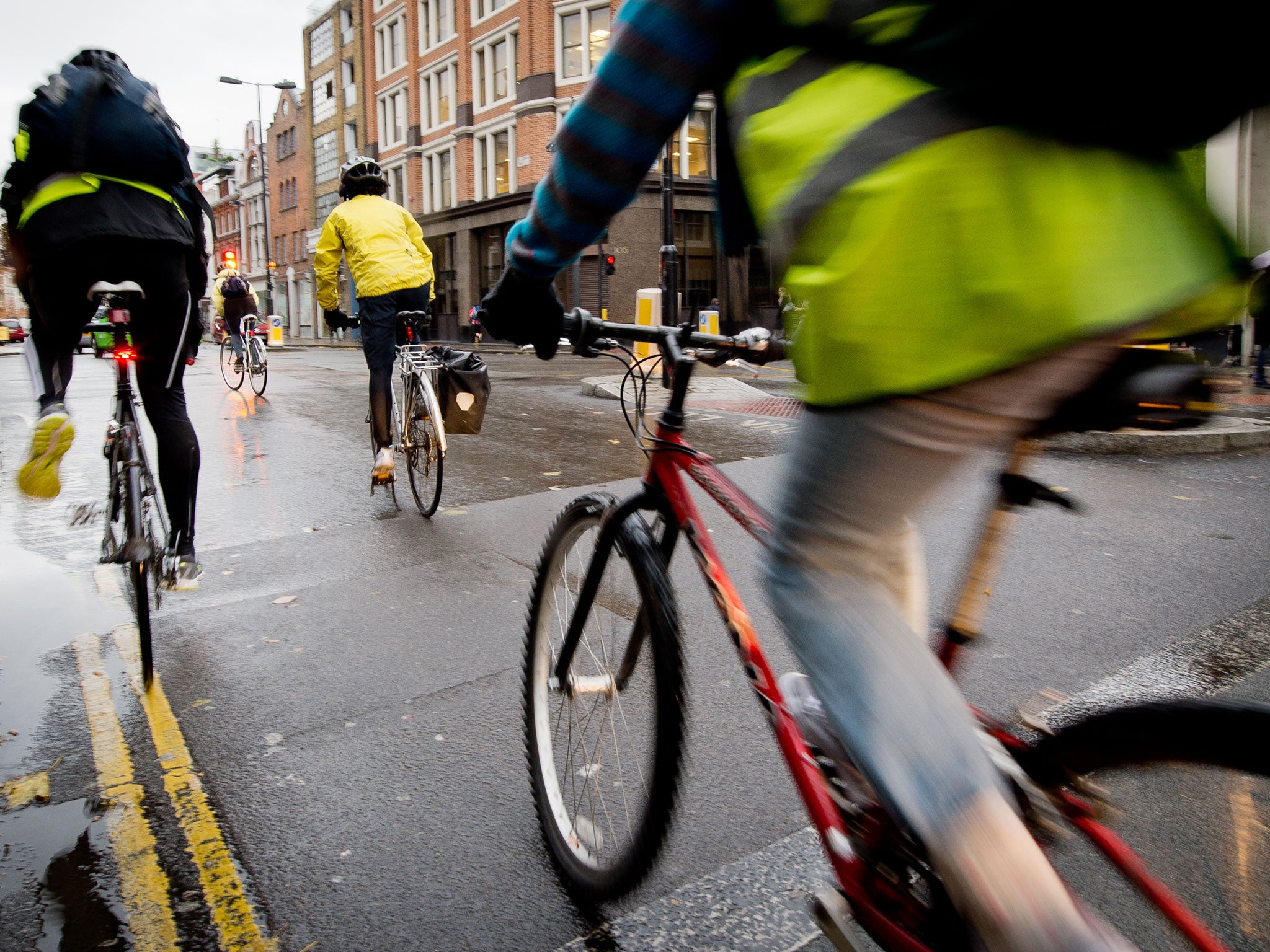 Cyclists ride in central London where the proposed SkyCycle routes would be built