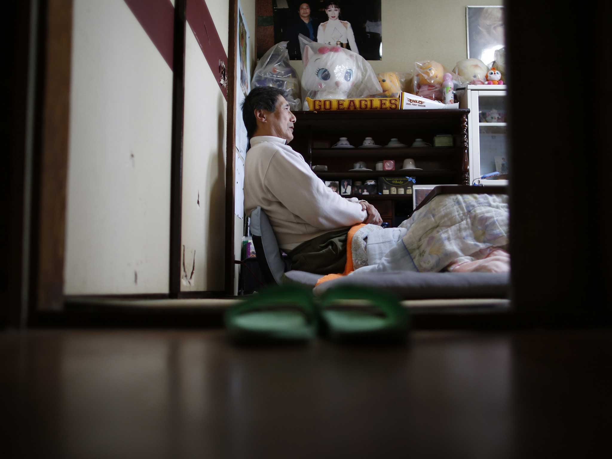 Seiji Sasa, a 67-year-old former professional wrestling promoter, at his home in Sendai (Reuters)