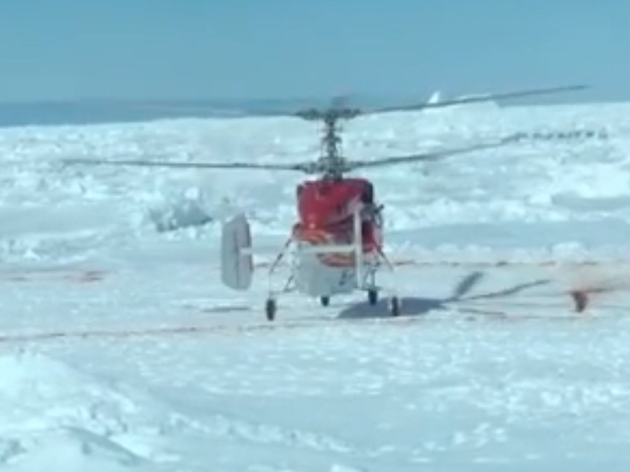 A helicopter from a nearby Chinese icebreaker lands near the Akademik Shokalskiy