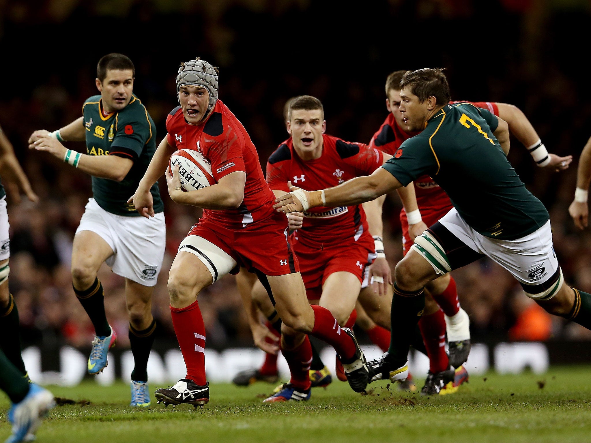 Wales centre Jonathan Davies, second left, is set to miss the Six Nations