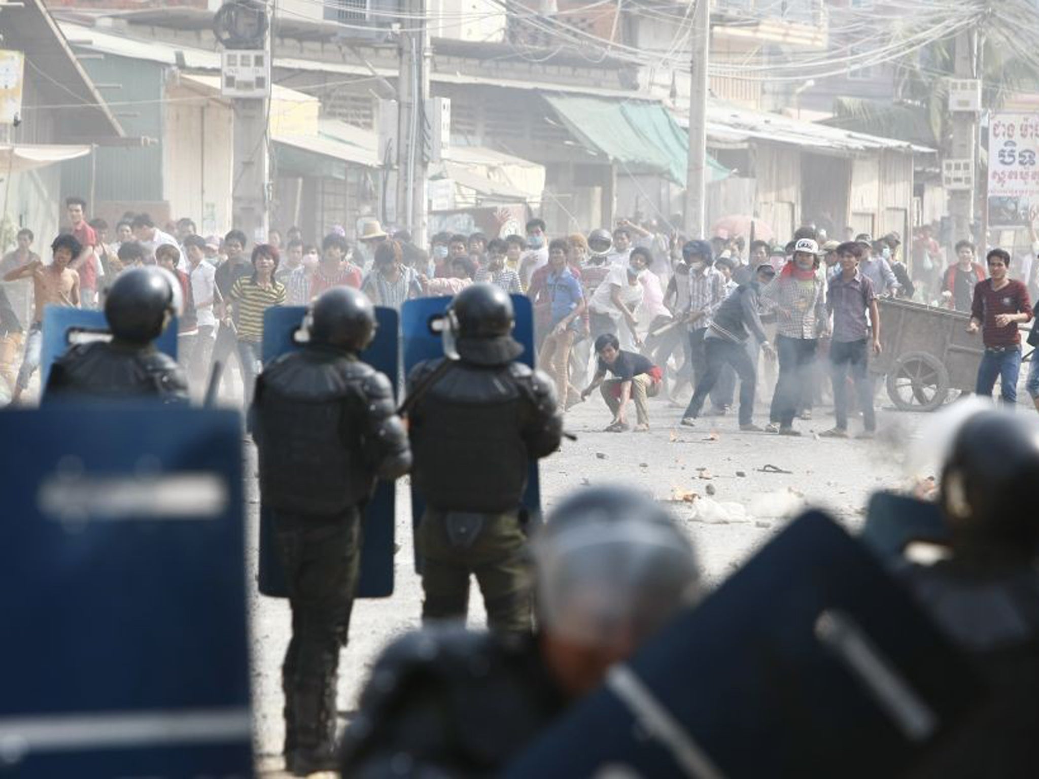 Cambodian riot police prepare to blockade garment workers during a strike near a factory of Canadia Centre, on the Stung Meanchey complex at the outskirt of Phnom Penh