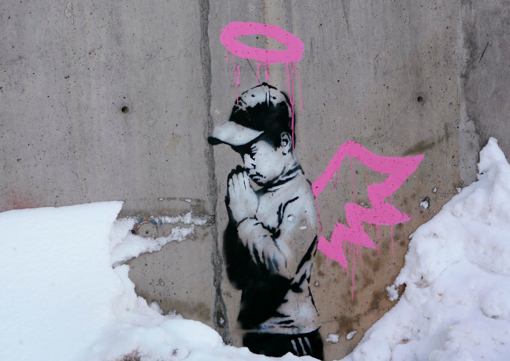 This artwork by Banksy was found covered in brown paint earlier this week