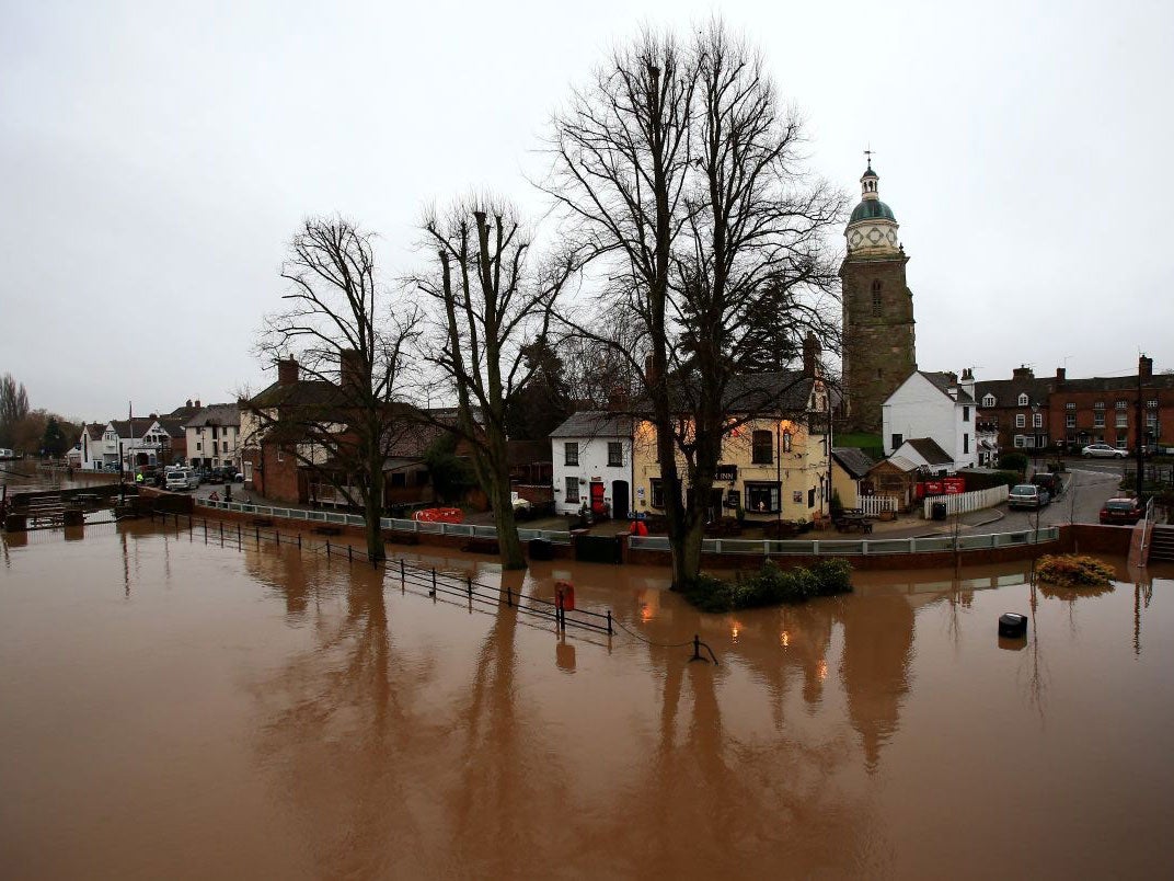 Flood water surrounds the Plough Inn besides the River Severn at Upton upon Severn