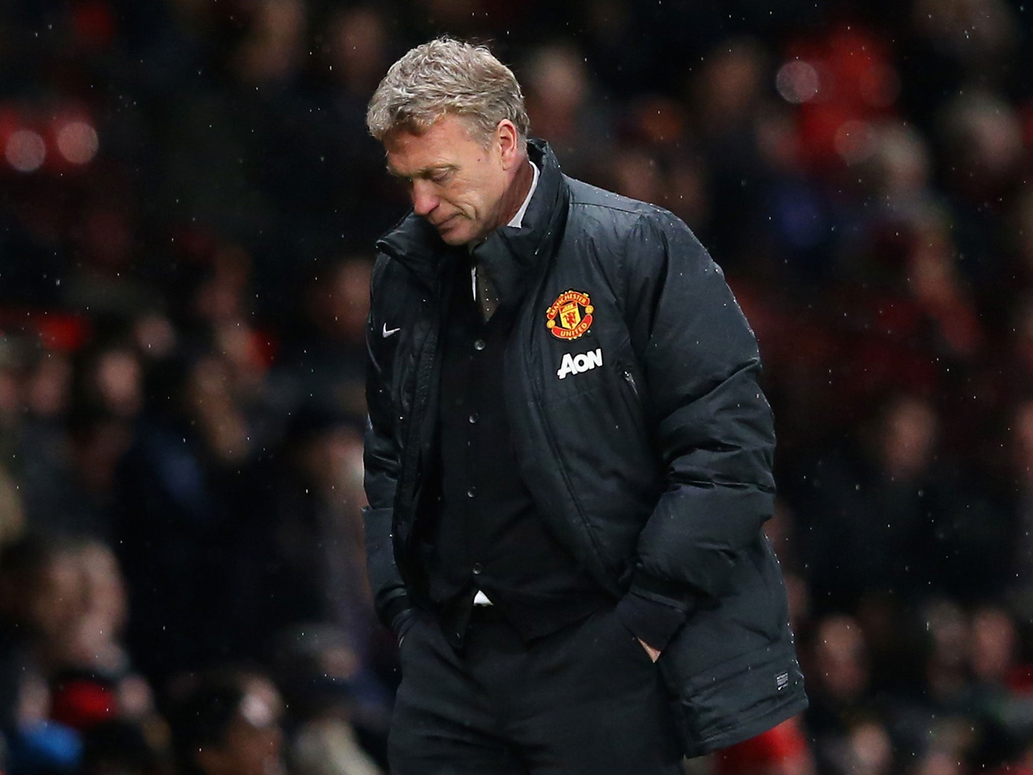 Manchester United manager David Moyes looks on in downbeat fashion