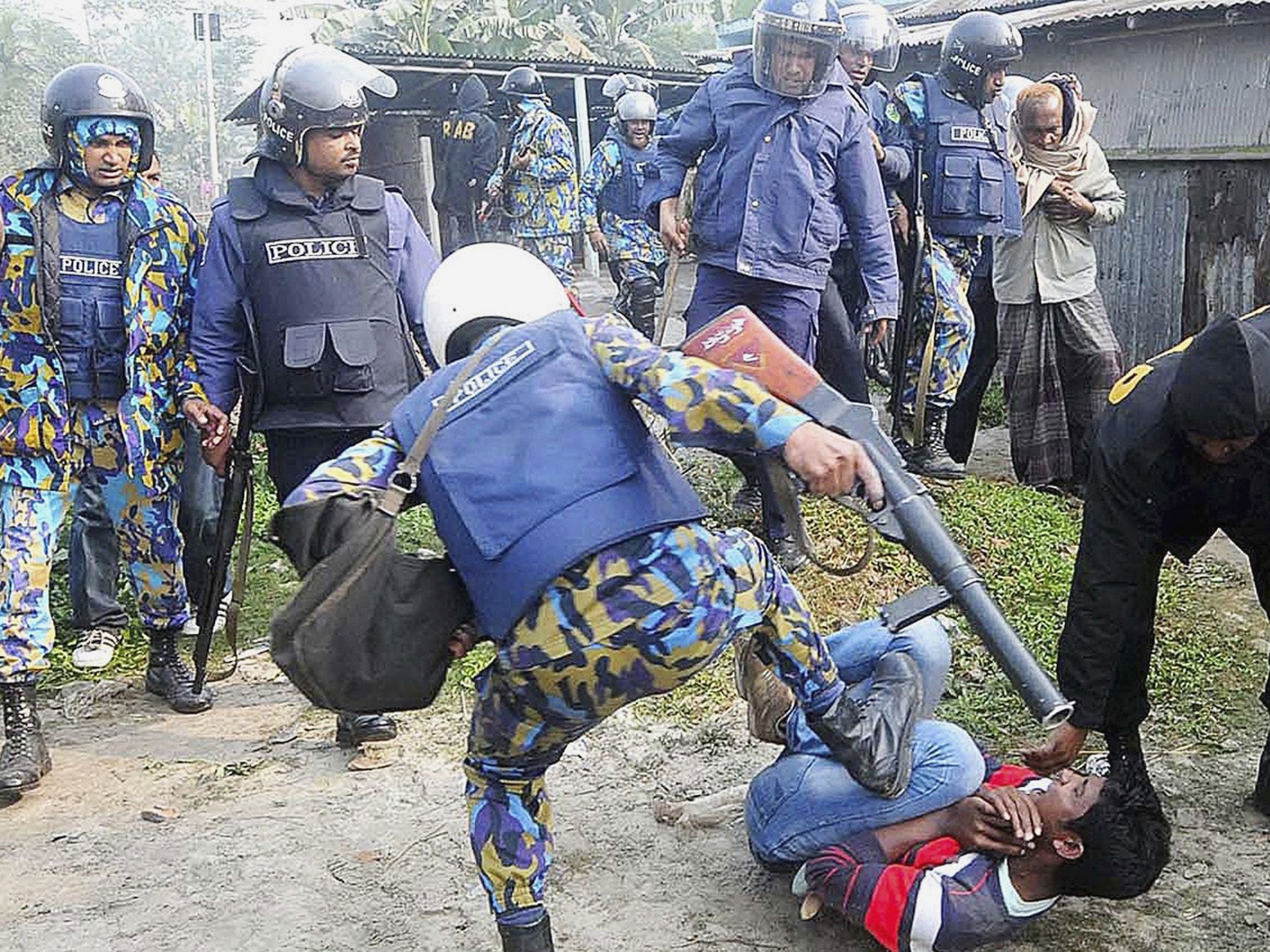 A clash between police and protesters after a crowd attacked polling booths in Bogra in the north