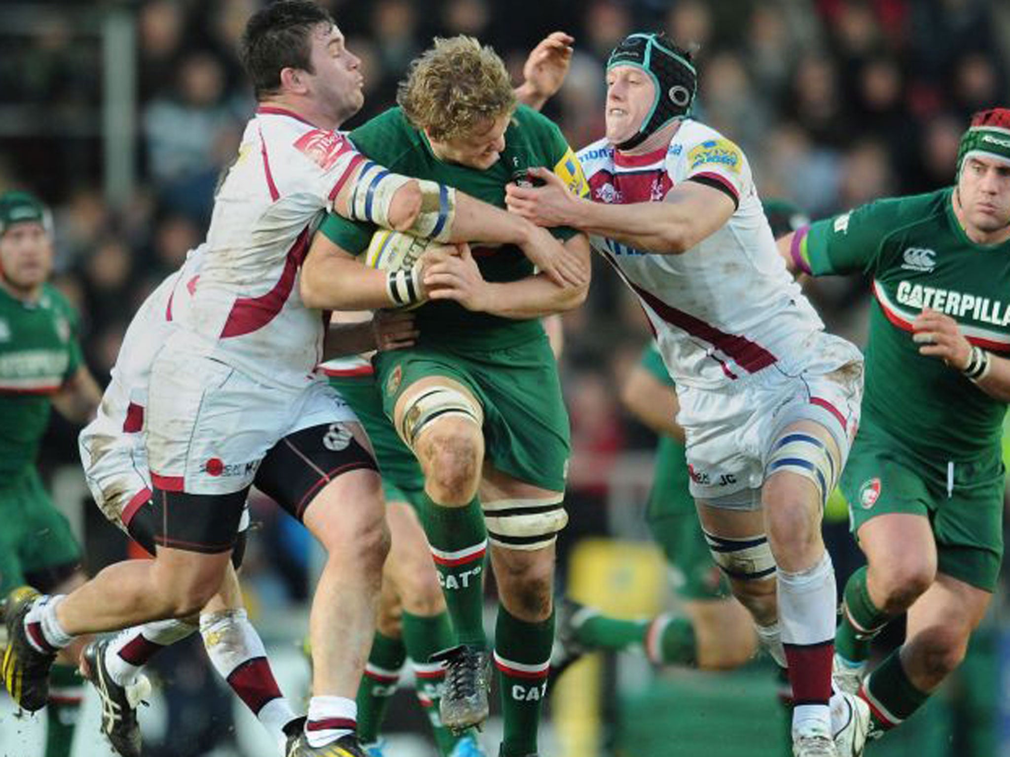 Leicester Tigers' Jamie Gibson is tackled by Sale Sharks' Marc Jones