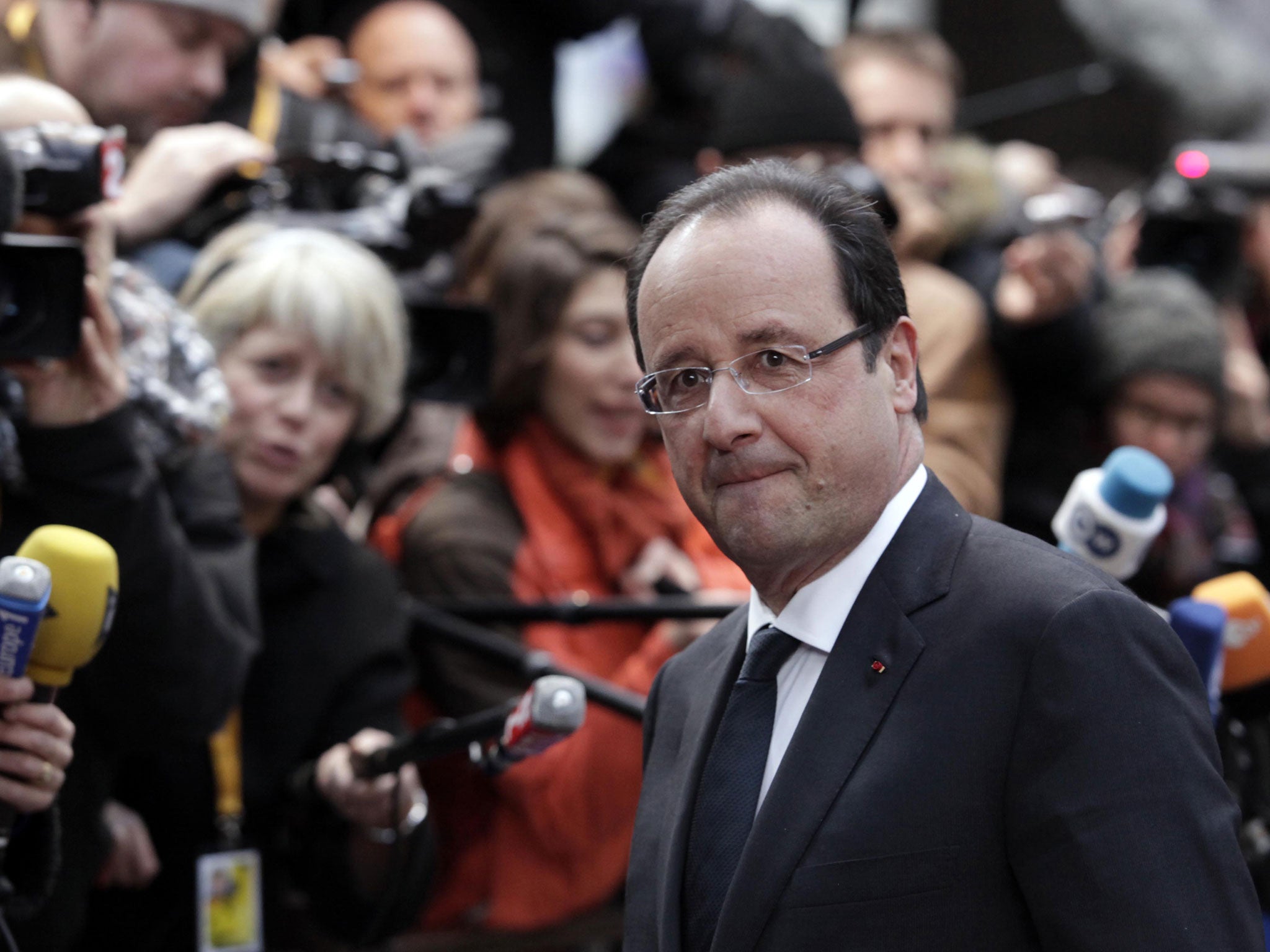 Mr Hollande is accused of abandoning his 'anti-finance' election promises