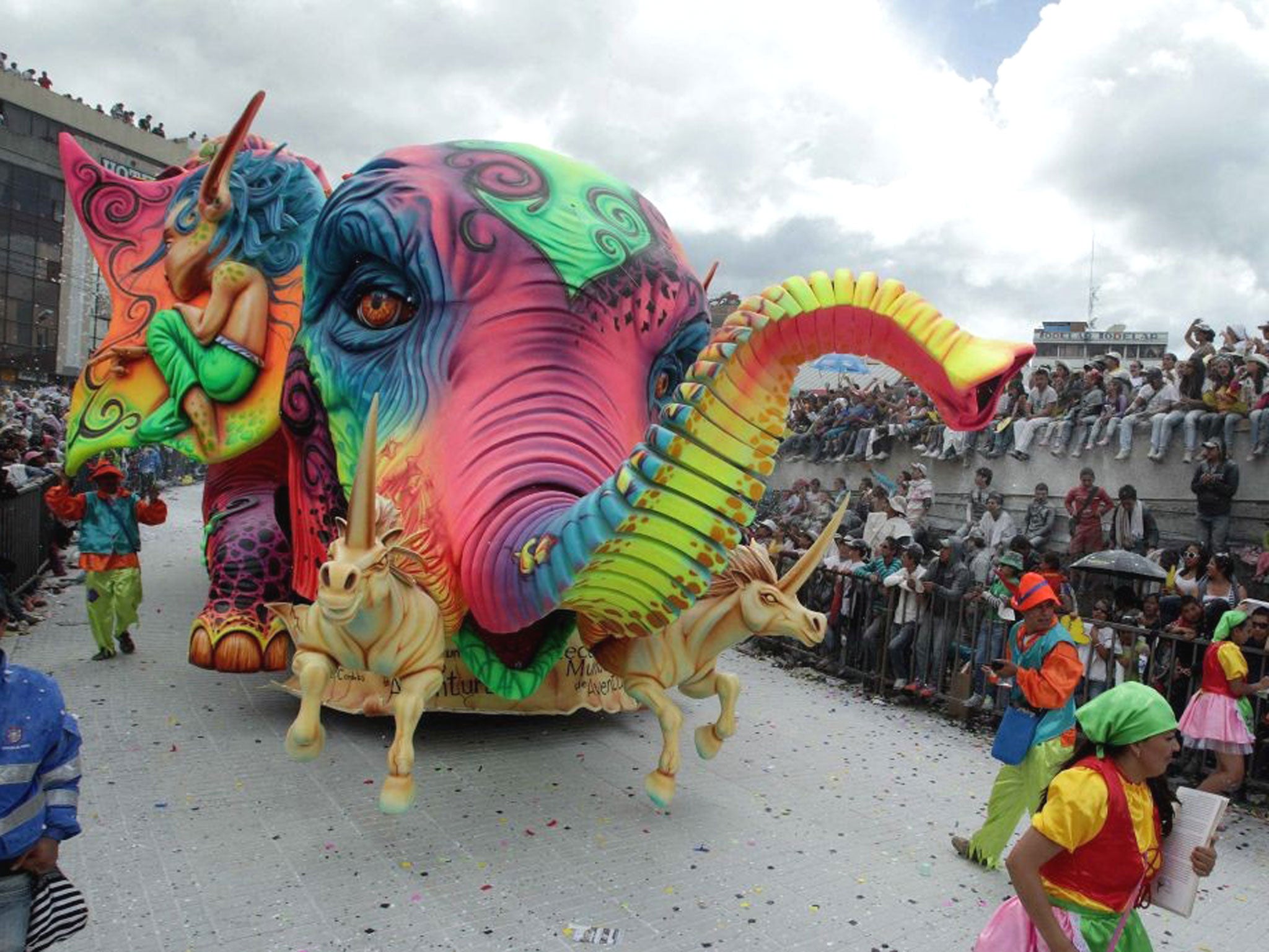 A group of people participates in a parade during the celebration of the Blacks and Whites Carnival in Pasto