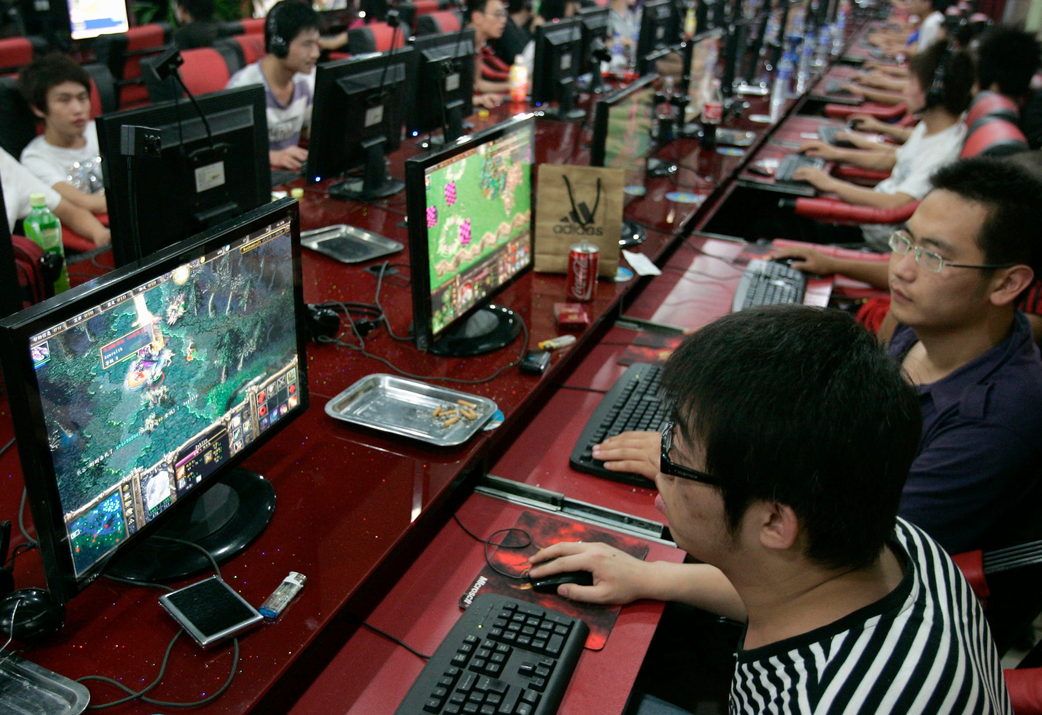 Customers play computer games at an Internet cafe in Taiyuan, Shanxi province, China.