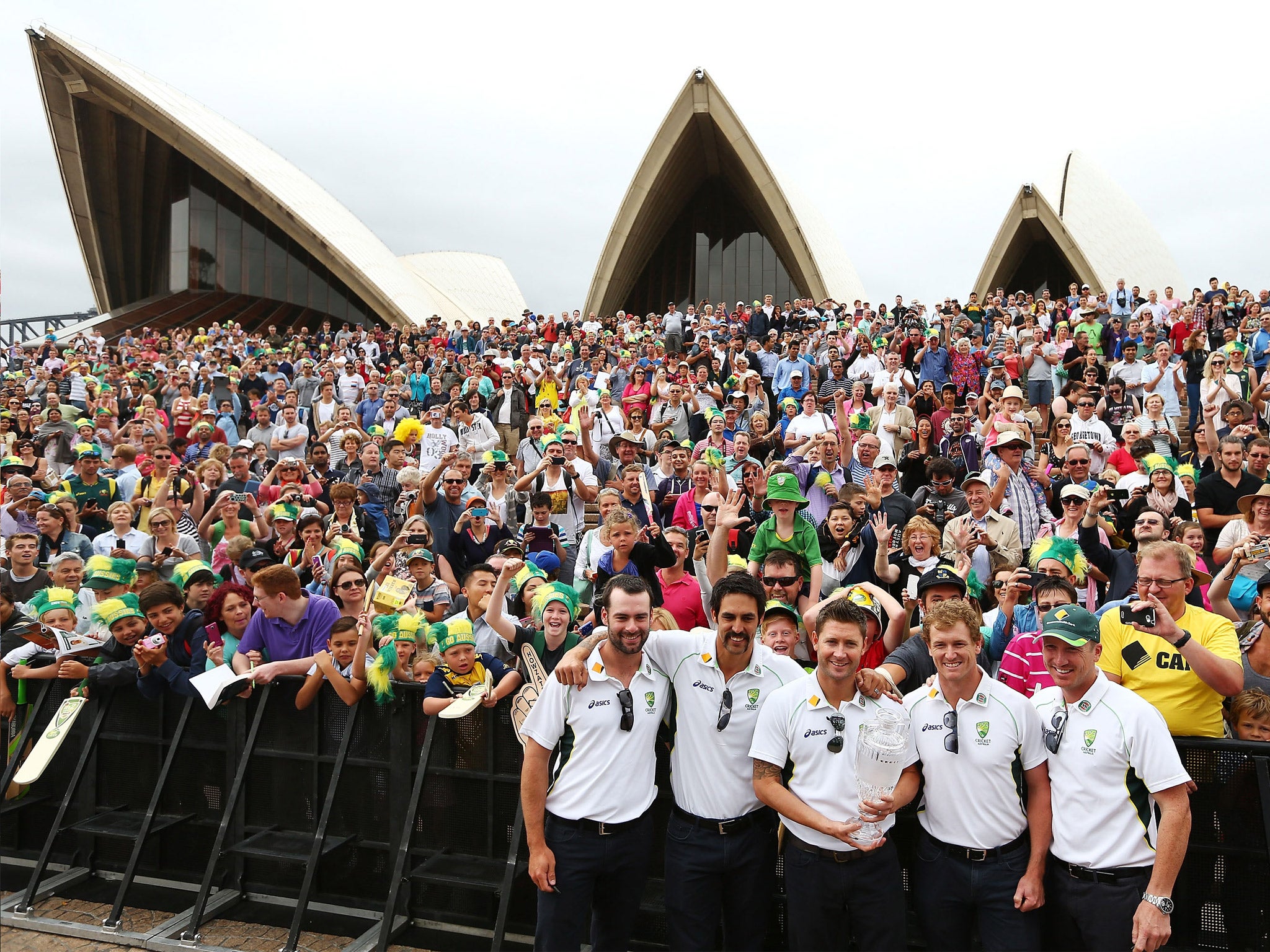 Australia’s Alex Doolan, Mitchell Johnson, Michael Clarke, George Bailey and Brad Haddin celebrate their Ashes whitewash with the public in front of the Sydney Opera House