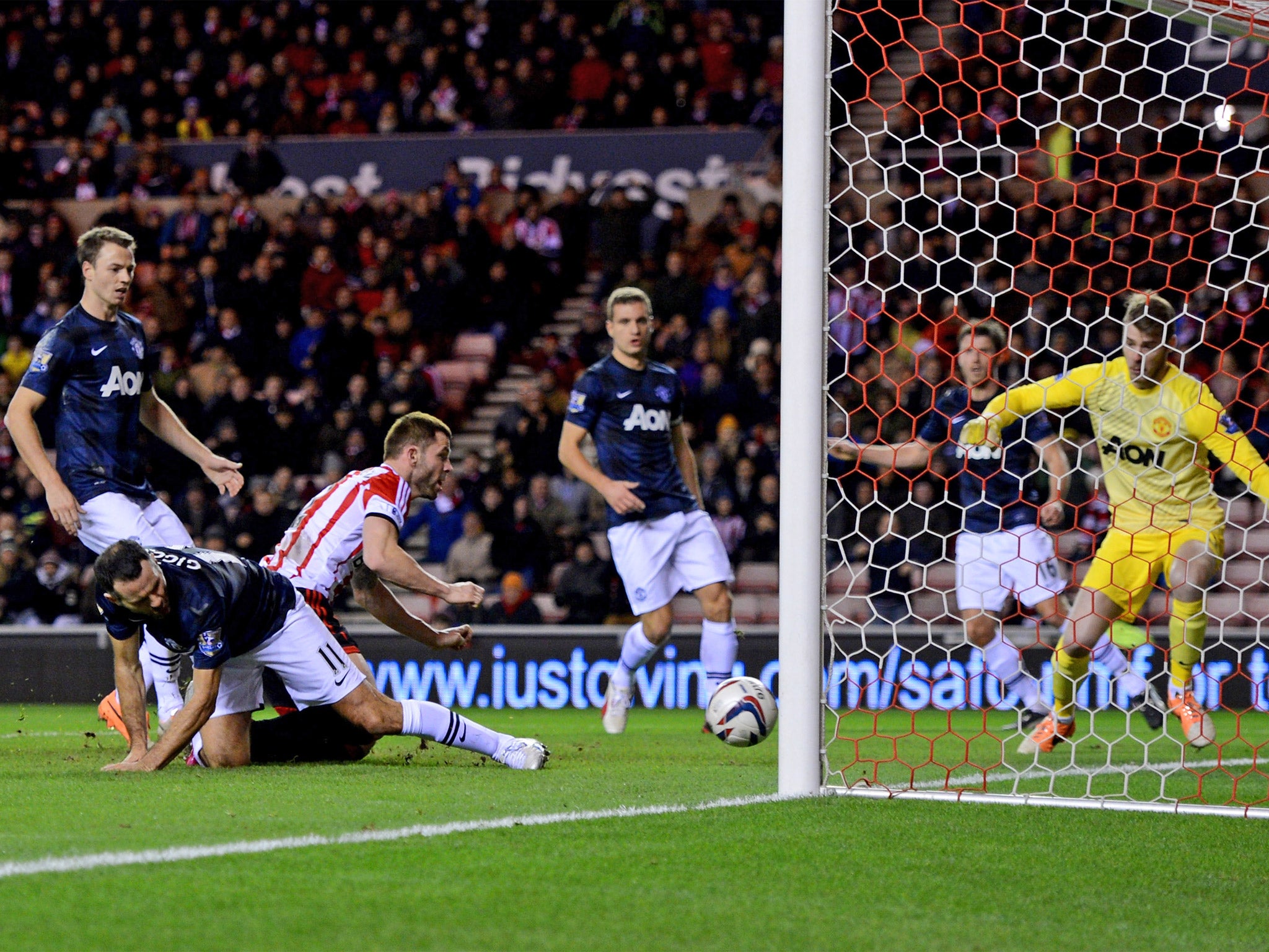 Ryan Giggs diverts the ball into his own net