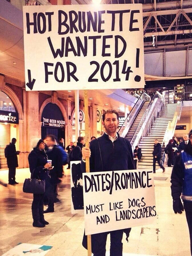 Gerald Abrahams dons his placard at Waterloo station