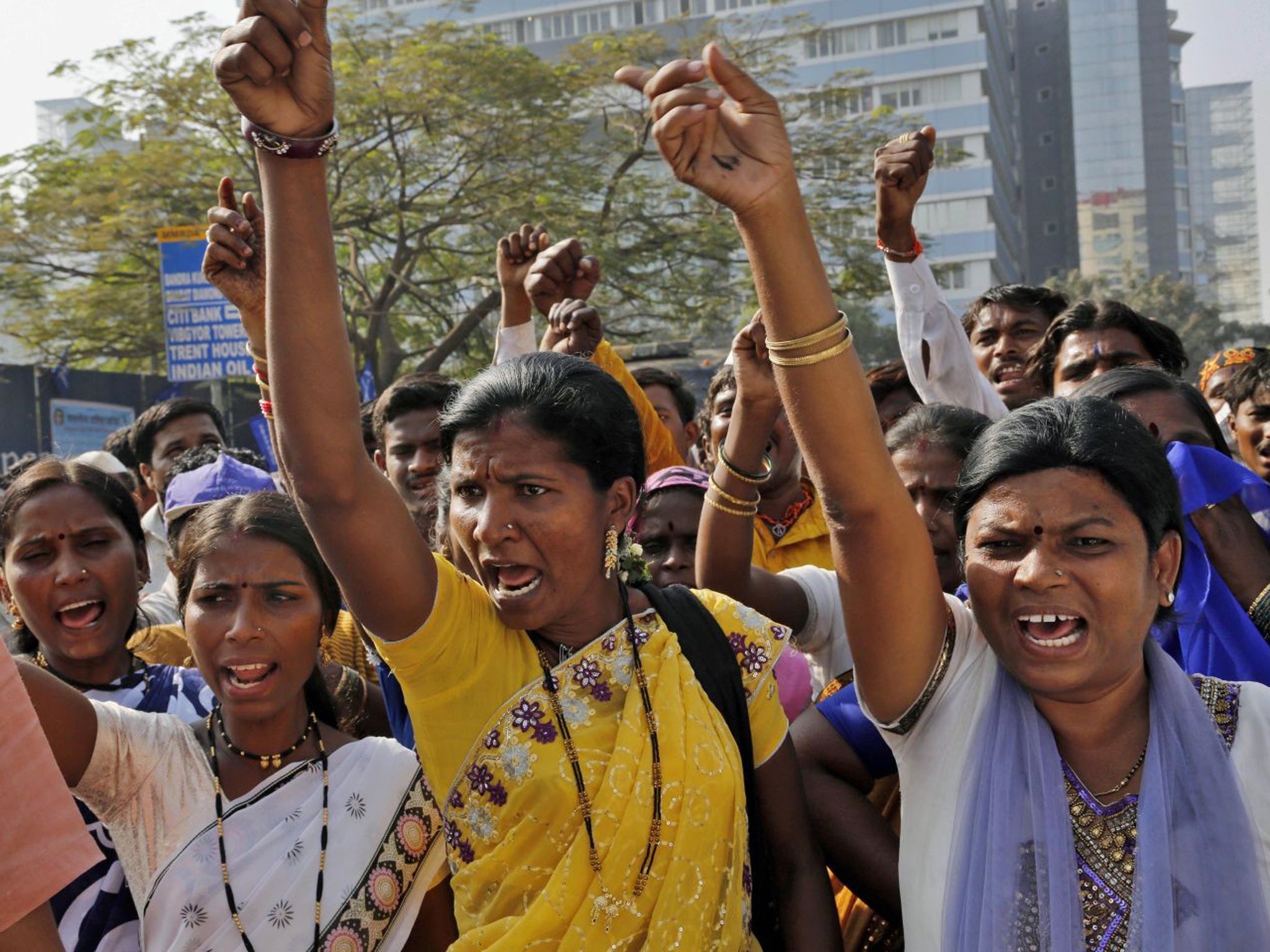 Indian activists protest outside the US consulate in Mumbai over the arrest of Indian consular Devyani Khobragade in New York, arrested and strip-searched for allegedly forcing her maid to work for little pay