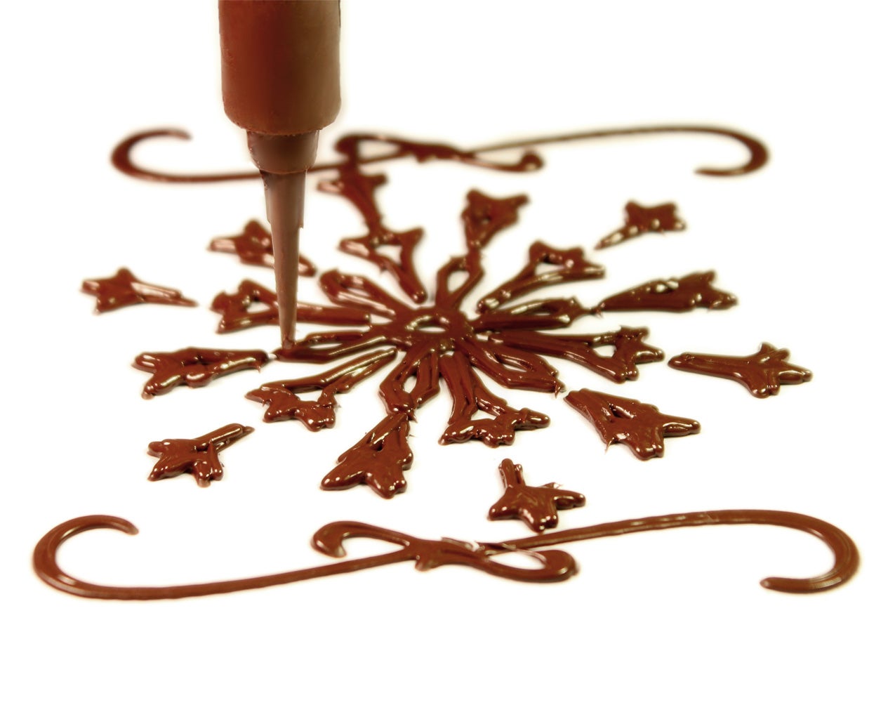 A chocolate snowflake design created by the Choc Creator 3D printer