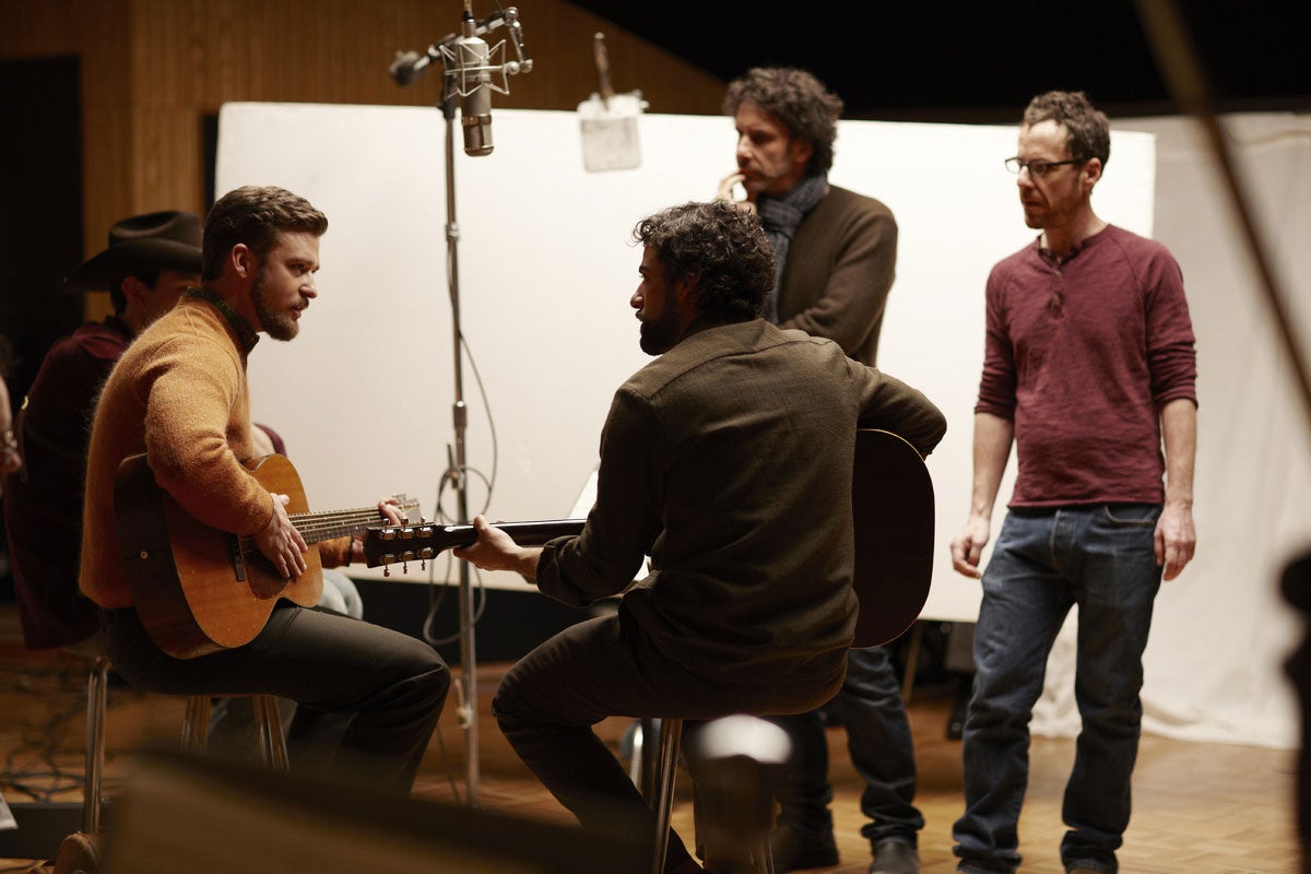 Adam Driver, Justin Timberlake and Oscar Isaac on set with Joel (left) and Ethan Cohen