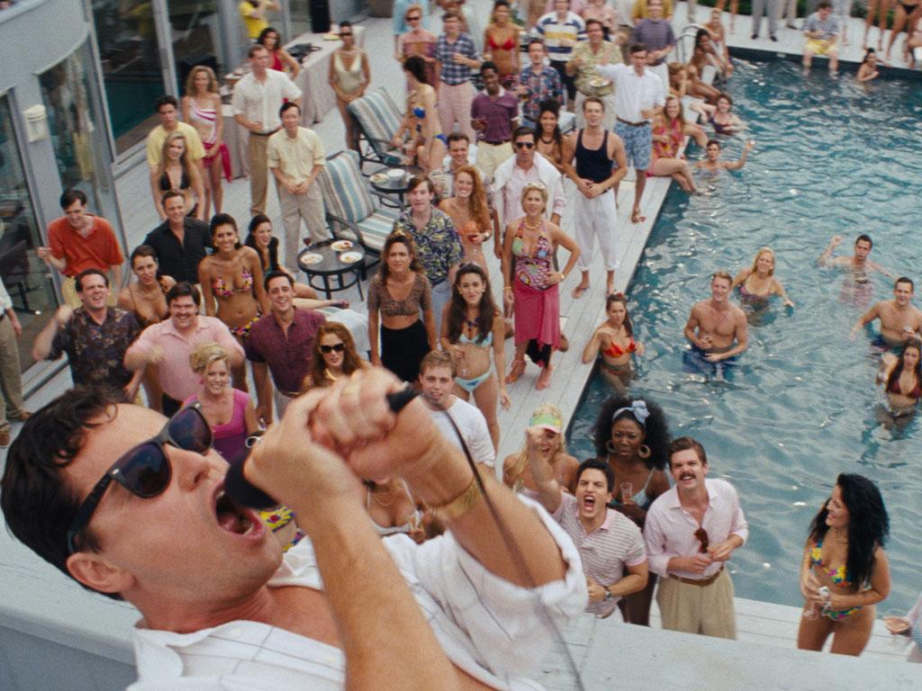 DiCaprio as the hard-partying Belfort overseeing a pool party for his Stratton Oakmont employees