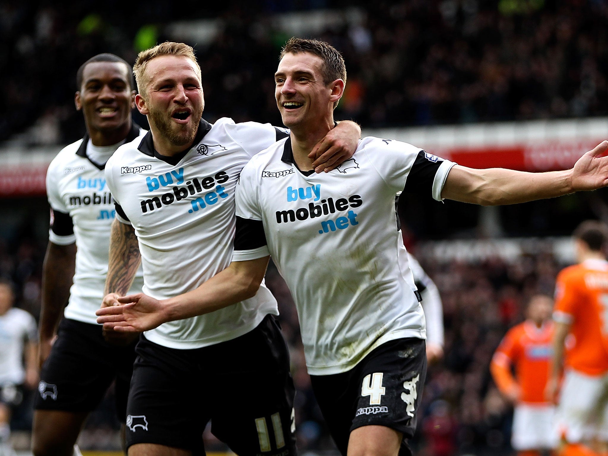 Craig Bryson, right, celebrates scoring for Derby