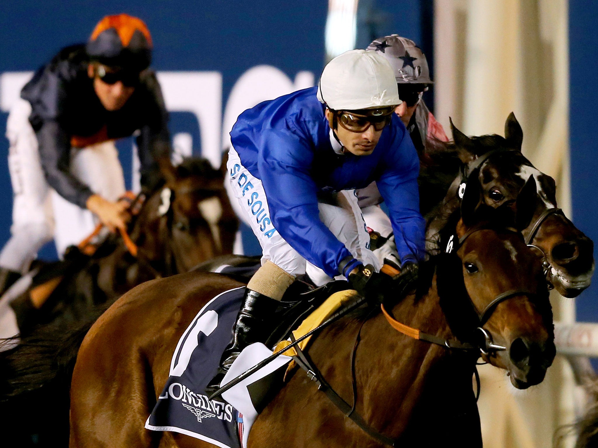 Shuruq, ridden by Silvestre de Sousa, wins the Al-Maktoum Challenge Round One in Godolphin's second colours