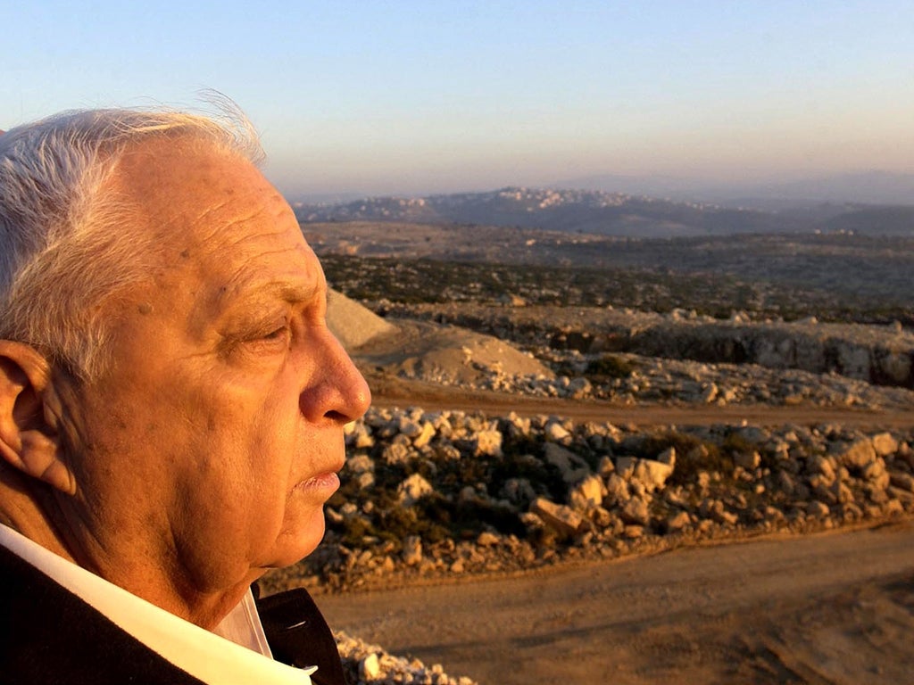 Israeli Prime Minister Ariel Sharon looks towards the West Bank