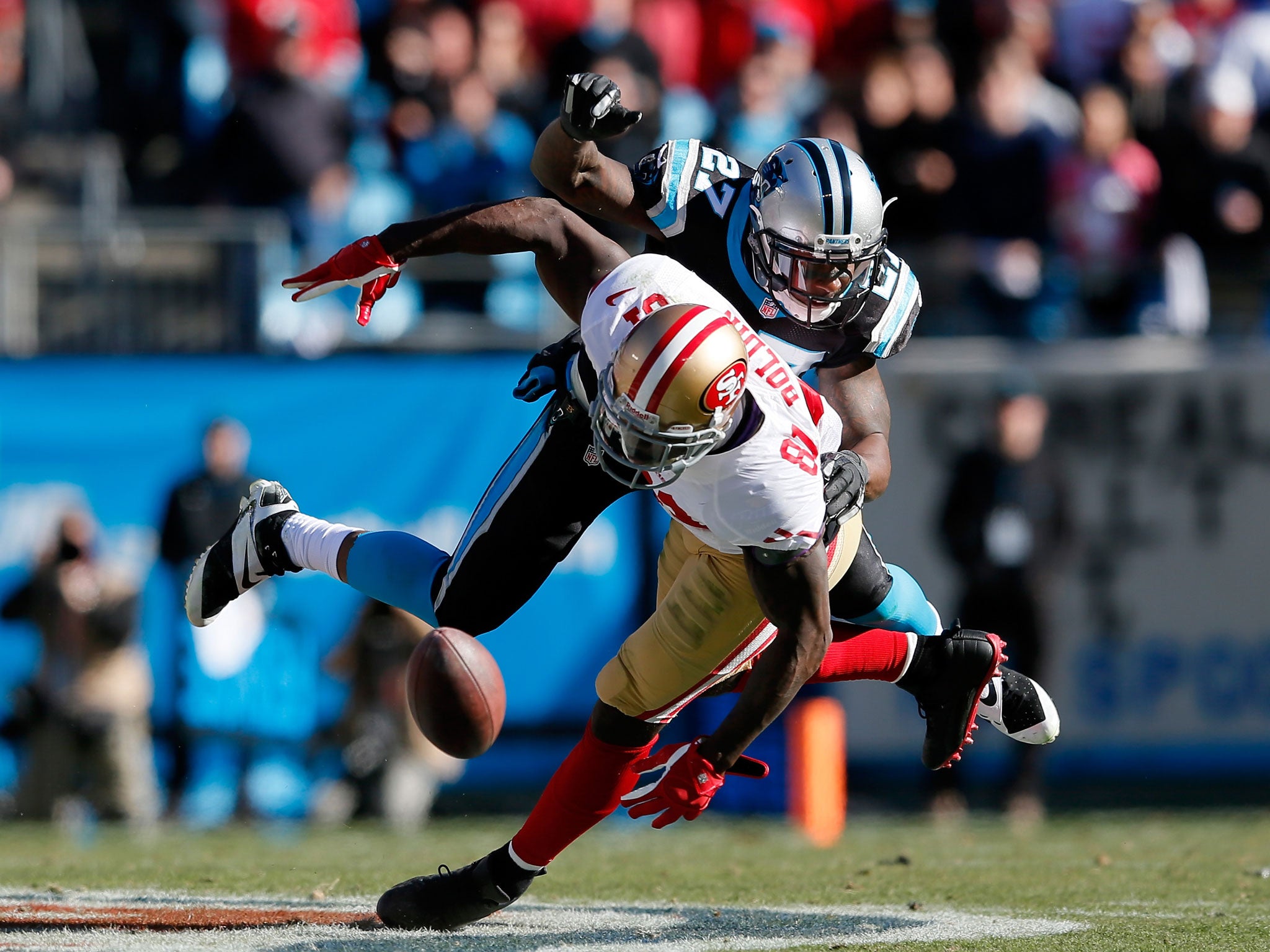 Anquan Boldin, right, and Quintin Mikel collide in last night’s NFC Divisional play-off