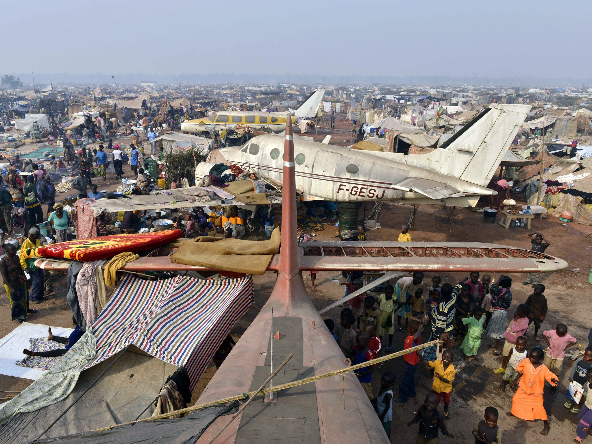 People gather at camp for internally displaced persons who have fled chaos in the Central African Republic.