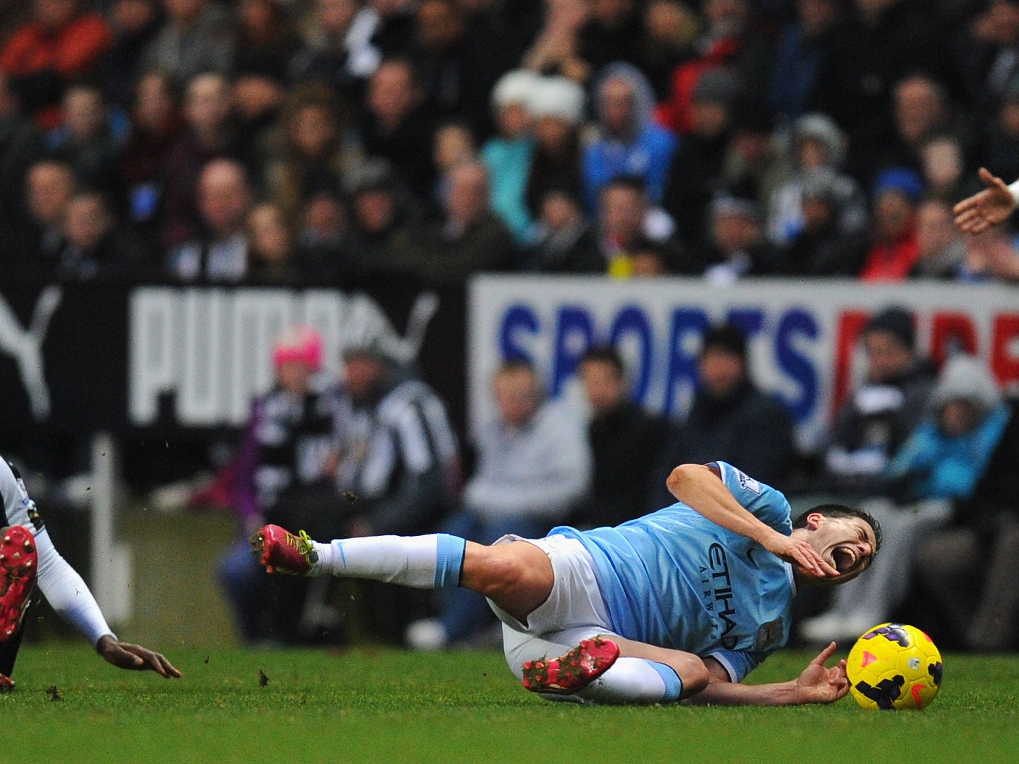 Samir Nasri screams out in pain after being brought down by Mapu Yanga-Mbiwa