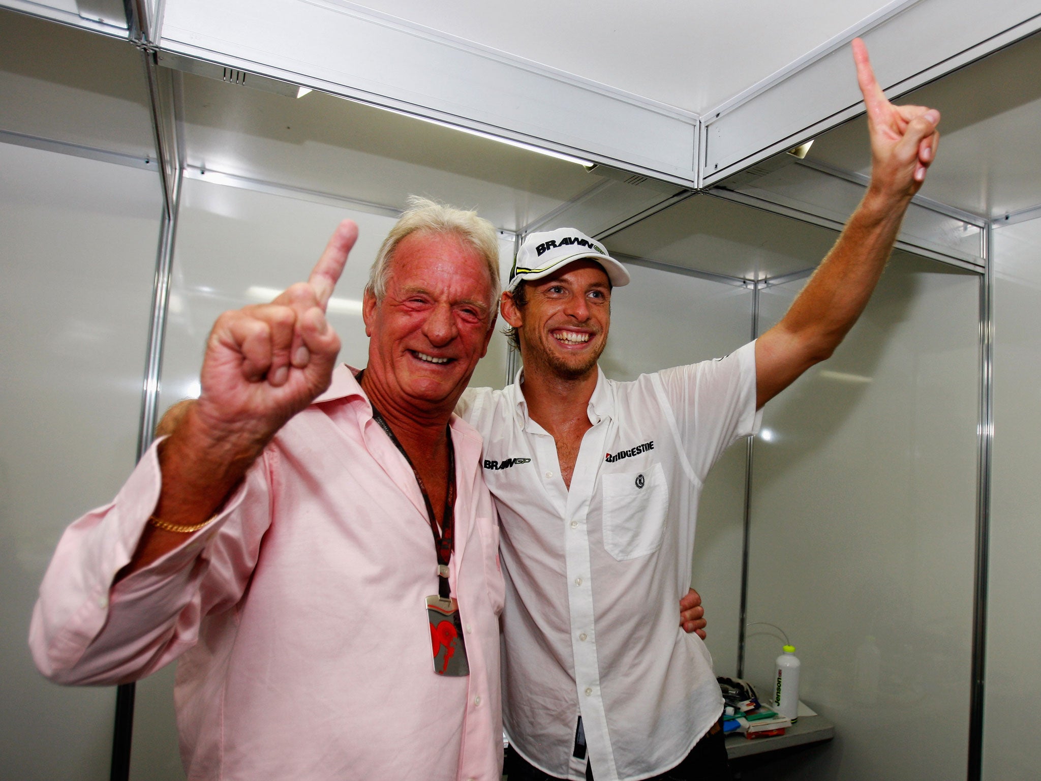 John Button celebrates with his son Jenson after he claimed the 2009 Formula 1 drivers' world championship