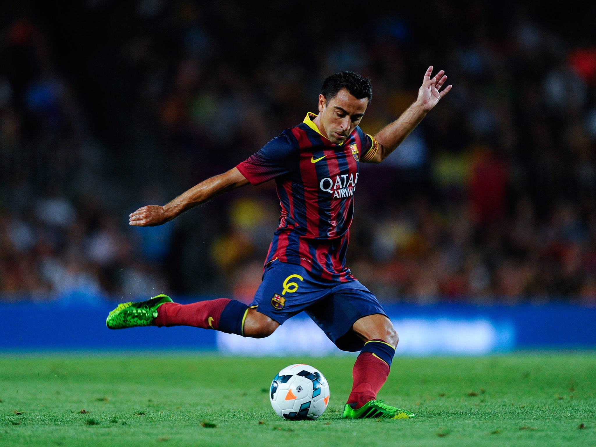 Xavi will continue for Barcelona despite his international retirement