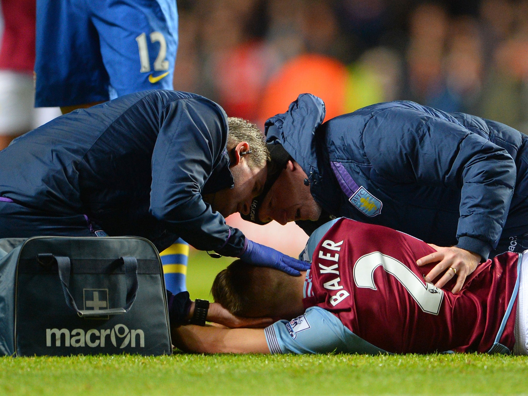 Nathan Baker receives treatment following a head injury