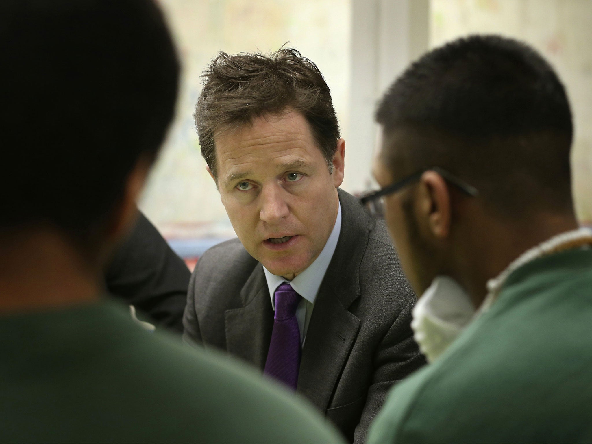 Nick Clegg speaks with inmates during a visit to the Cookham Wood Young Offenders Institution in Rochester