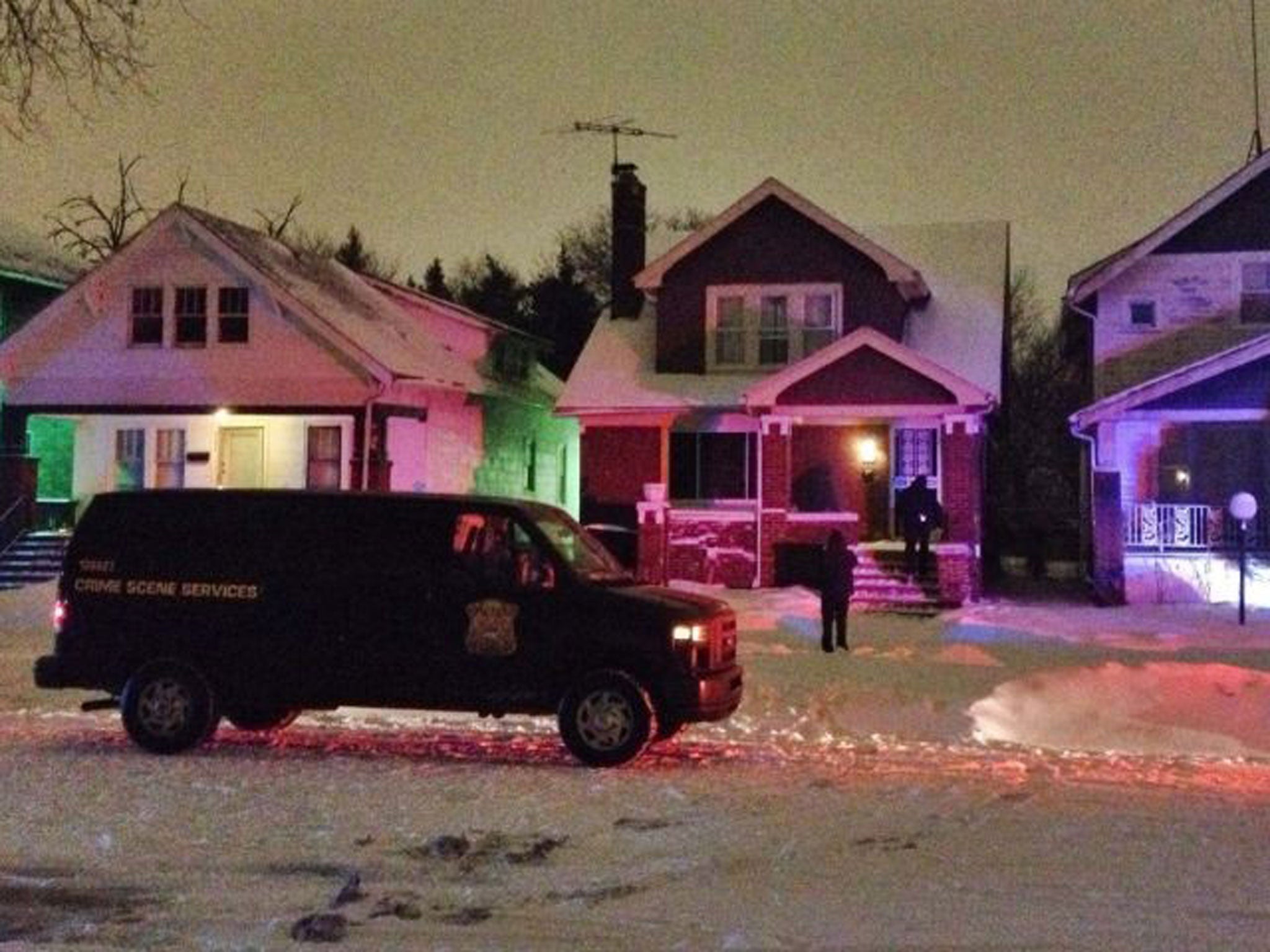 A crime scene vehicle outside the house