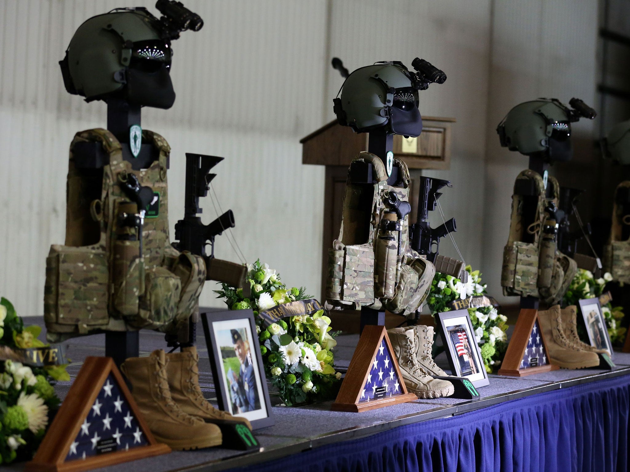 The dog tags rifles and body armour of the fallen Airmen of the United States Air Force 56th Rescue Squadron during a memorial service at RAF Lakenheath, who died when their Pave Hawk helicopter crashed on 7 January