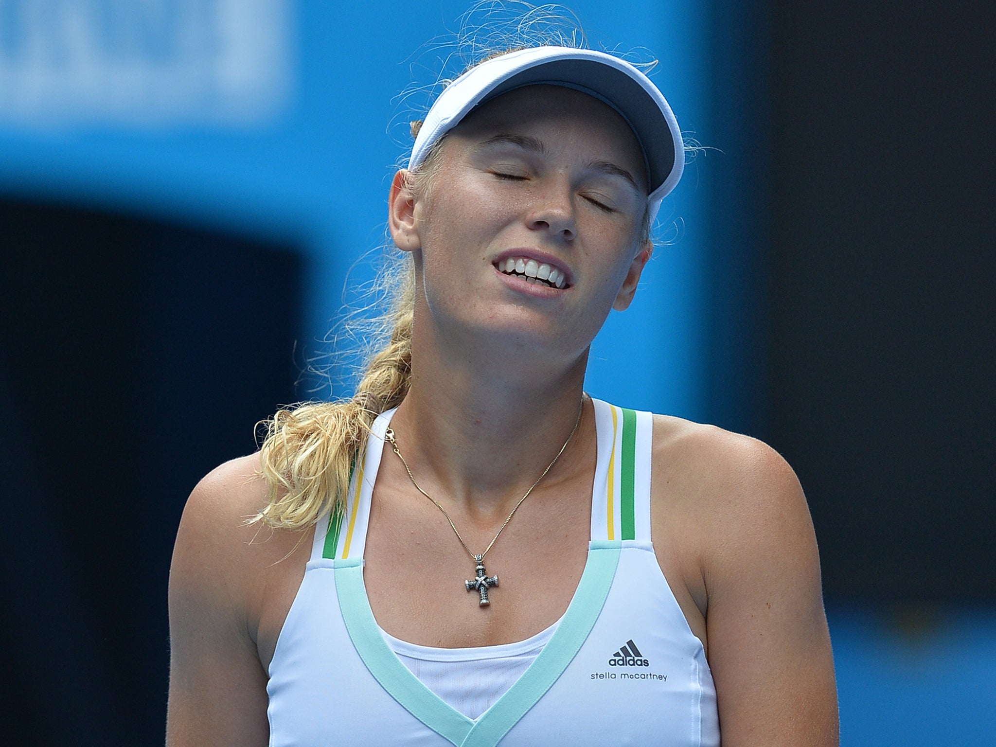 Caroline Wozniacki was knocked out of the Australian Open after losing 4-6 7-5 6-3 to young Spaniard Garbine Muguruza