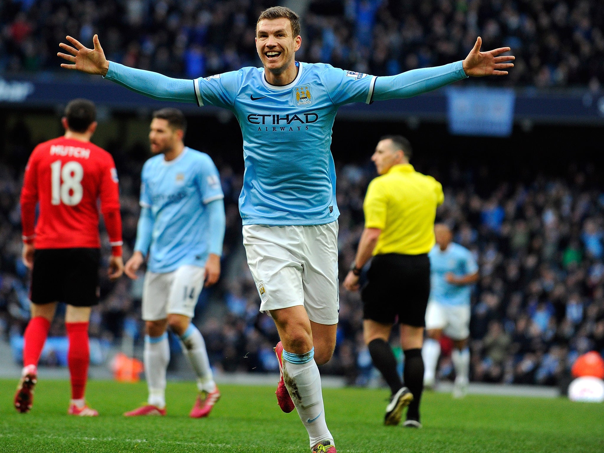 Manchester City striker Edin Dzeko celebrates after scoring their 100th goal of the season in the win over Cardiff