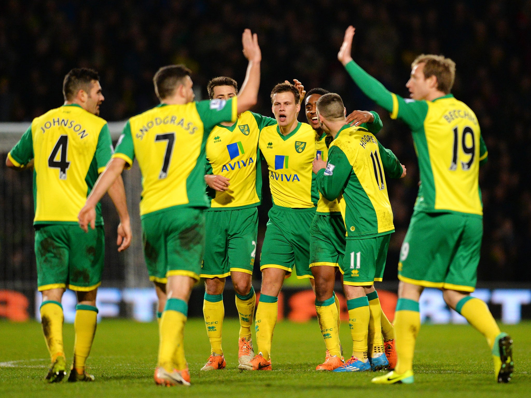 Norwich City players celebrate after Ryan Bennett scored a late winner against Hull City