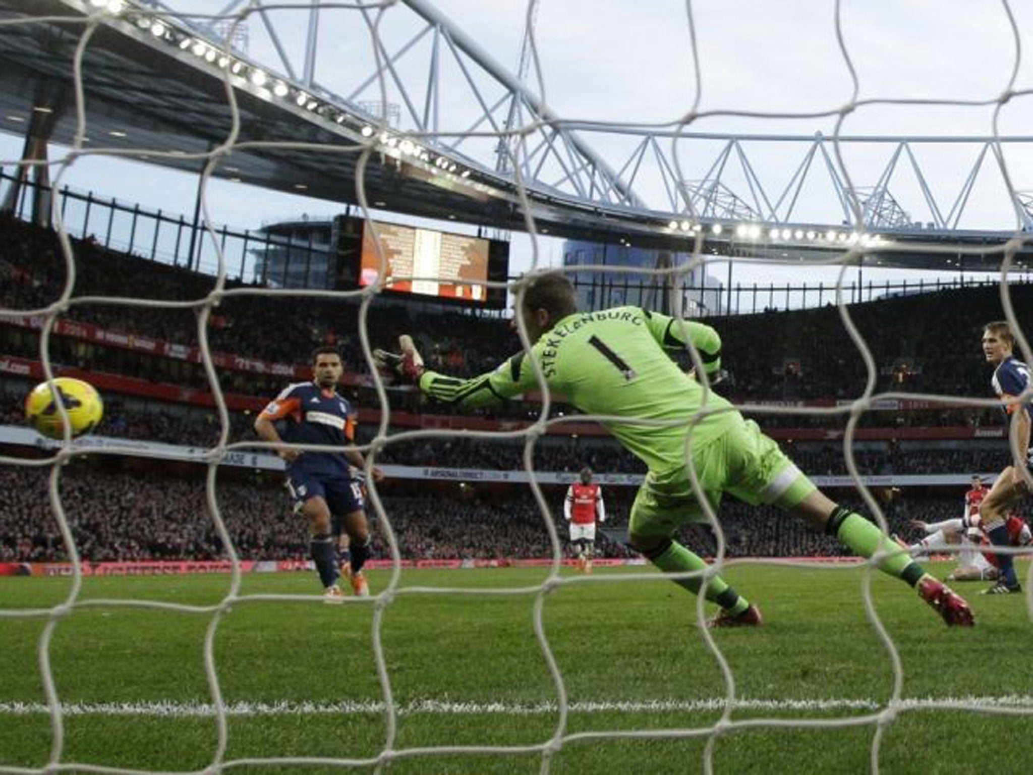 Heaven Santi: Santi Cazorla beats Maarten Stekelenburg to score the first of his two goals in five minutes