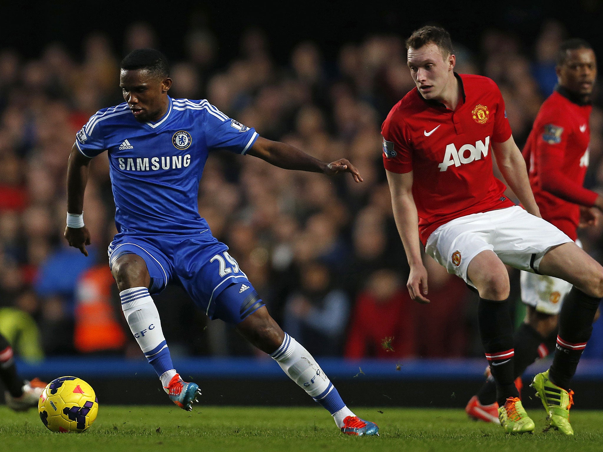 Samuel Eto'o takes the ball past Phil Jones