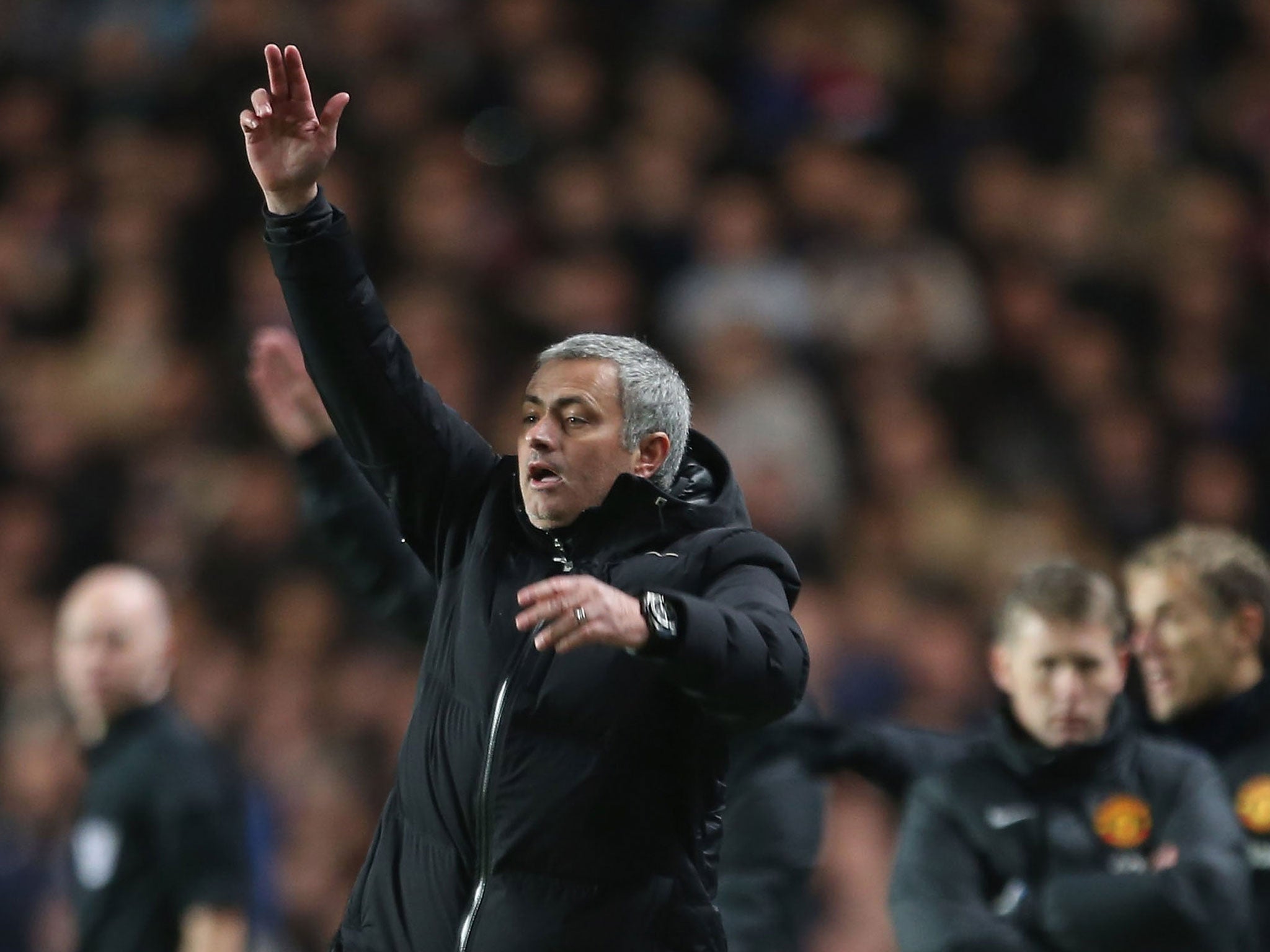 Jose Mourinho makes a gesture from the touchline during Chelsea's 3-1 win over Manchester United