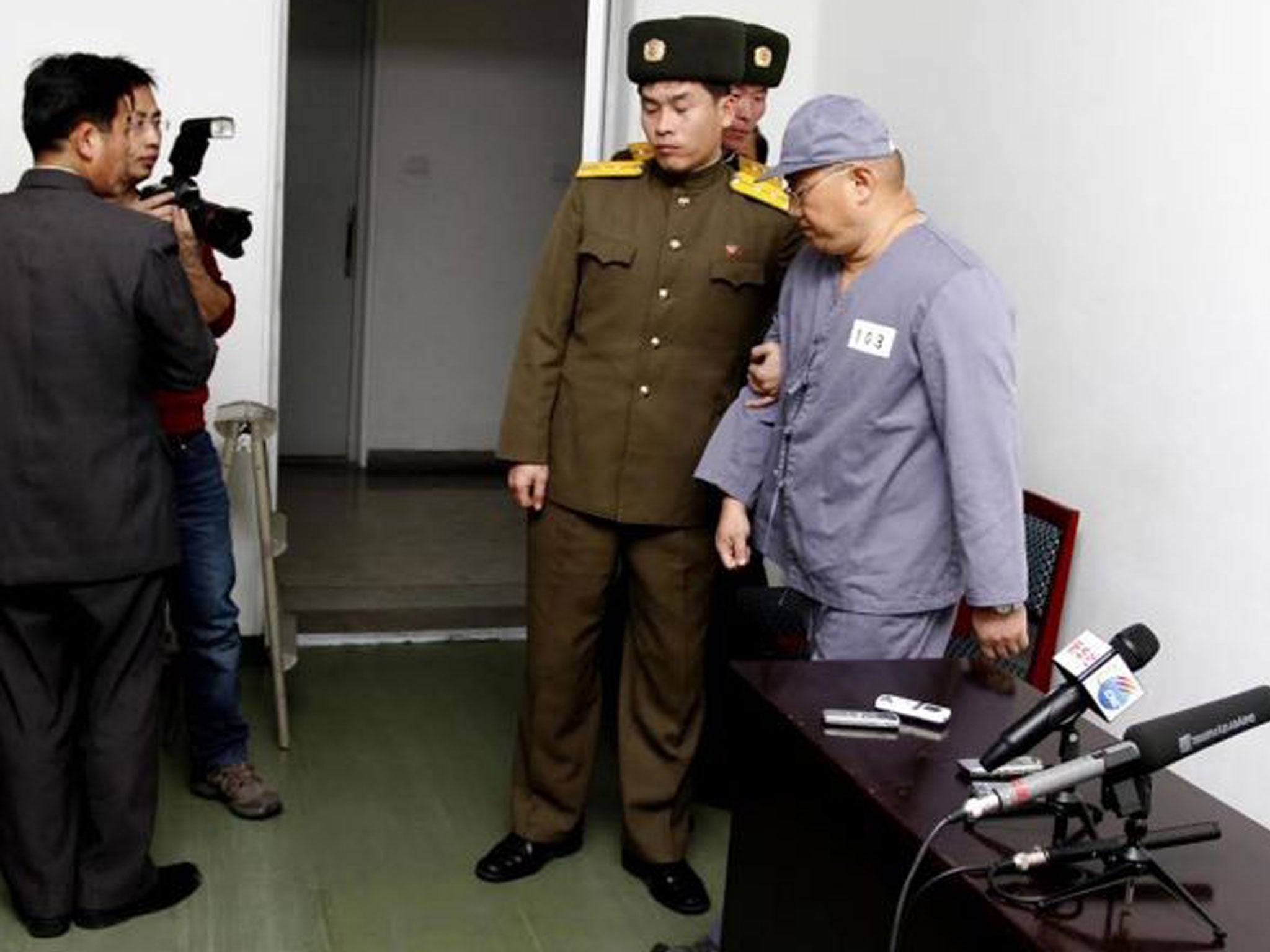 American missionary Kenneth Bae leaves after speaking to reporters.