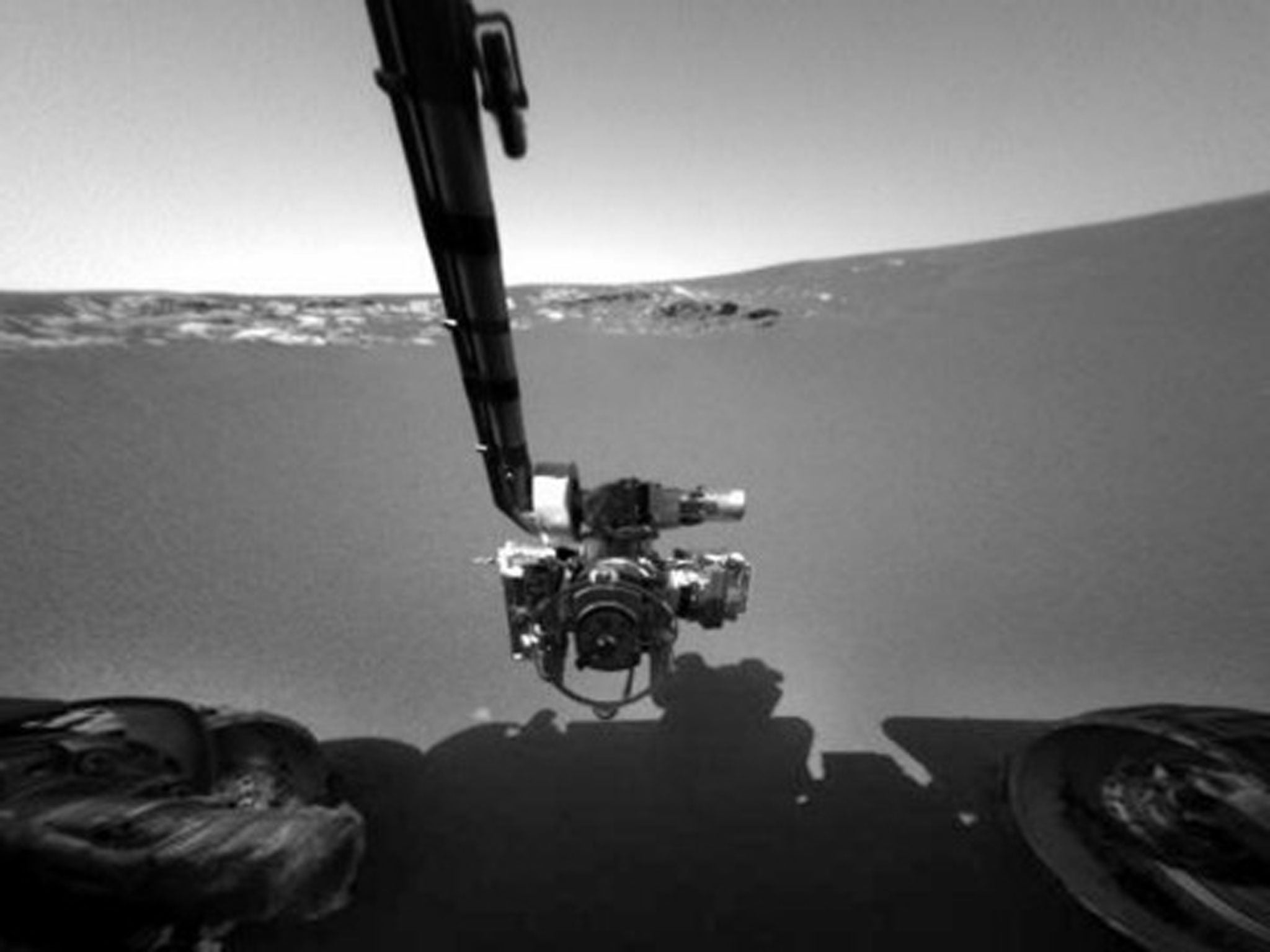 Mars rover Opportunity's robotic arm as it stretched over the surface of Mars