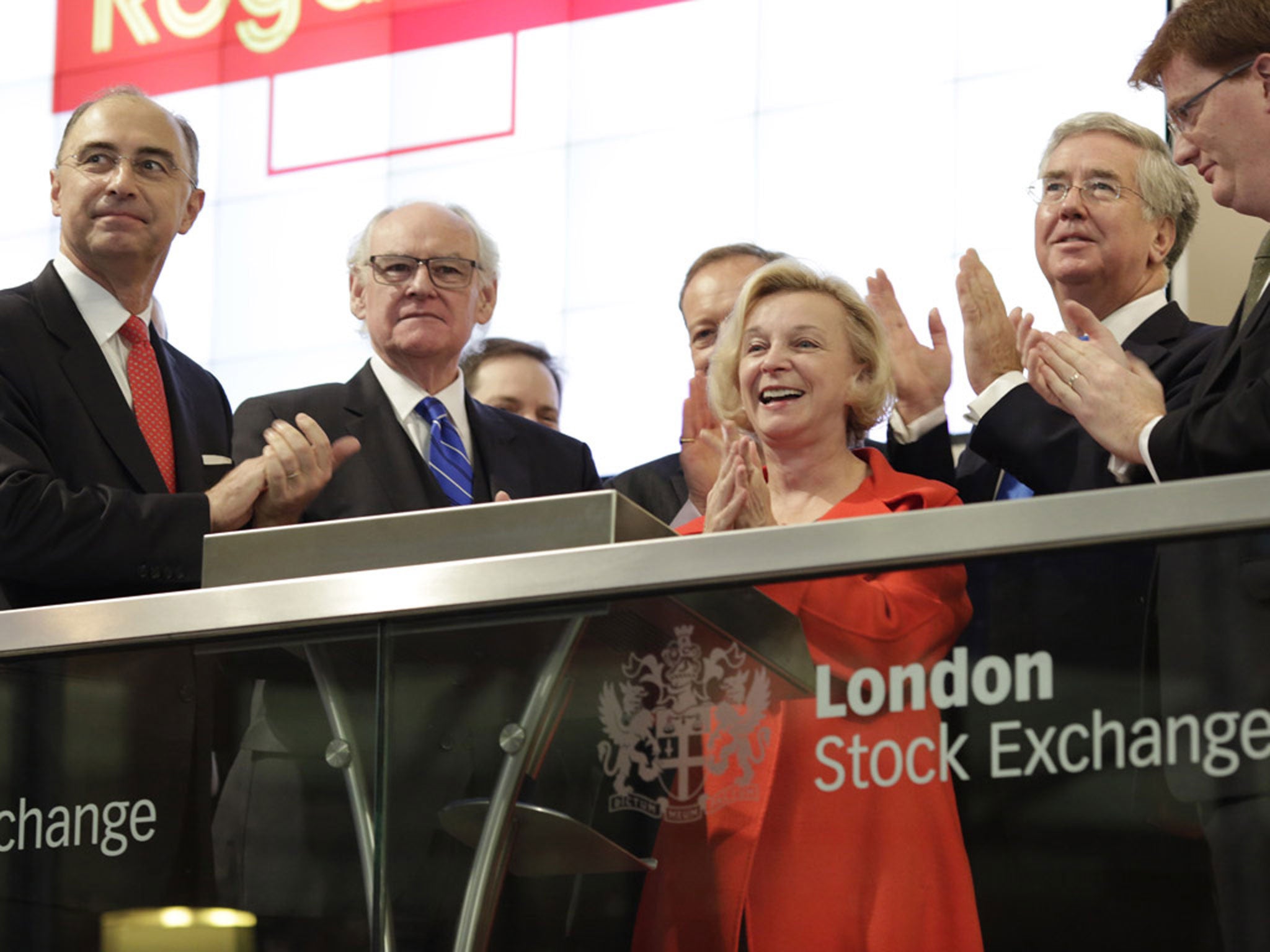 Moya Greene in red at the London Stock Exchange in October 2013; Moya Greene's £1.5m earnings were modest compared to those of other FTSE 100 bosses