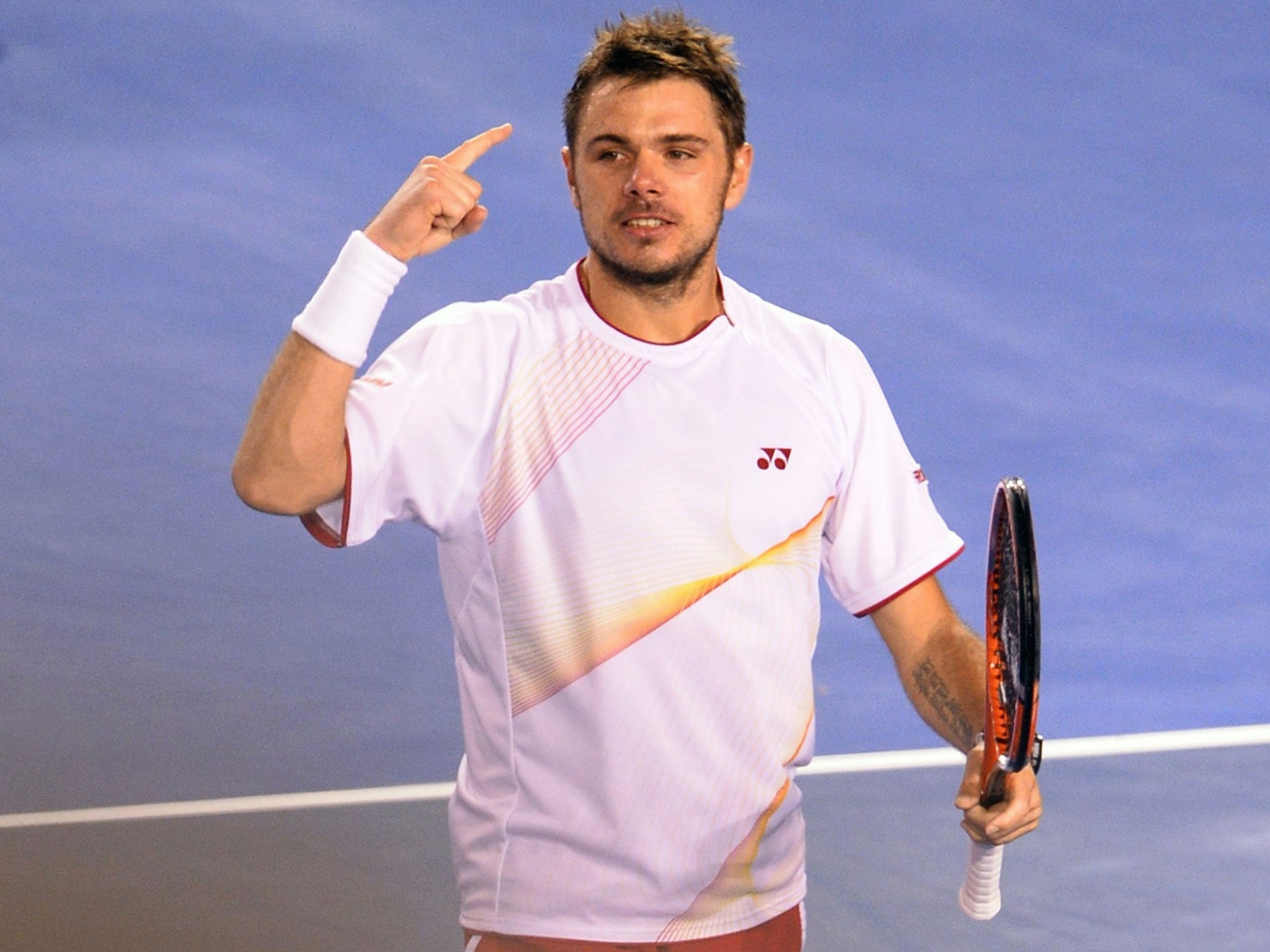 Stanislas Wawrinka celebrates his Australian Open quarter-final victory over defending champion Novak Djokovic