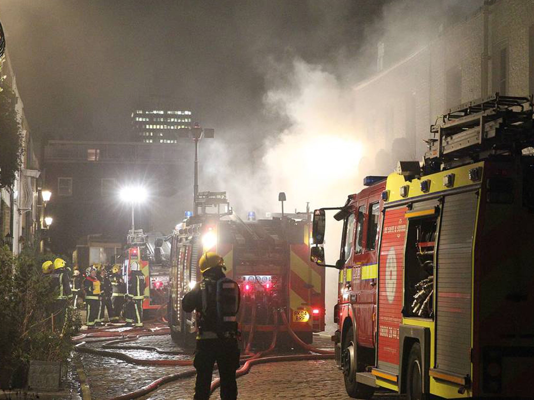 Emergency workers battle to contain the flames