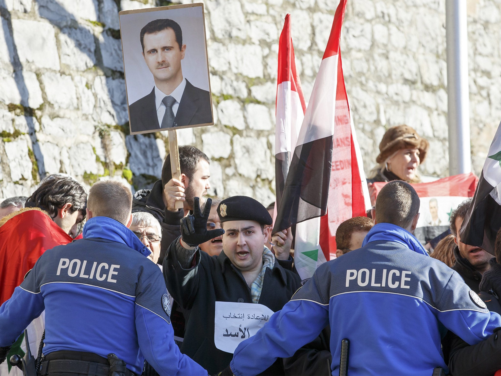 President Bashar al-Assad supporters stage a protest in Montreux