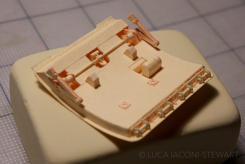 A detailed look at one of the cargo doors, complete with a working lock and hinge constructed entirely from paper.