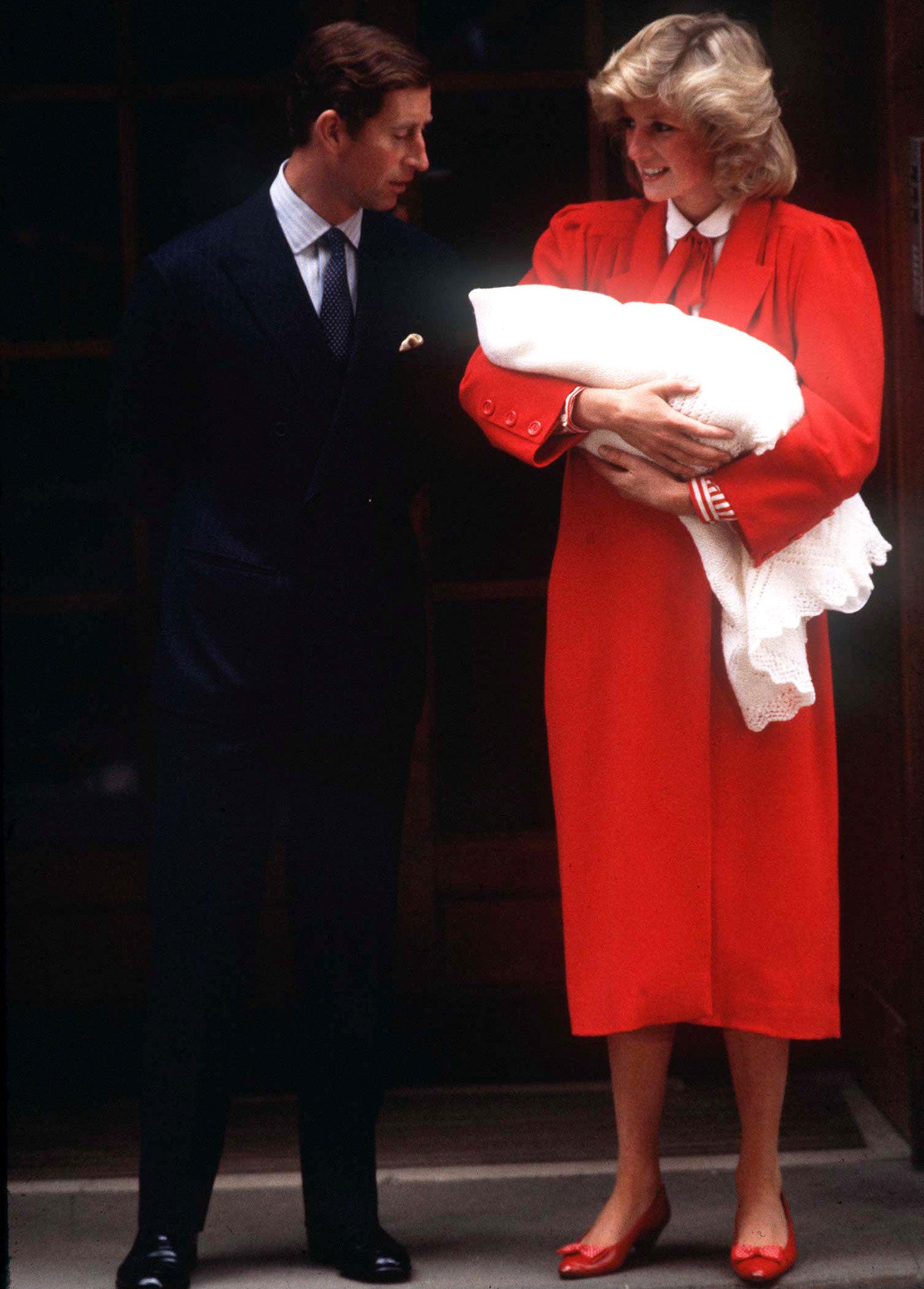 Princess Diana holding baby Prince Harry as she and Prince Charles leave St. Marys hospital in London, 1984