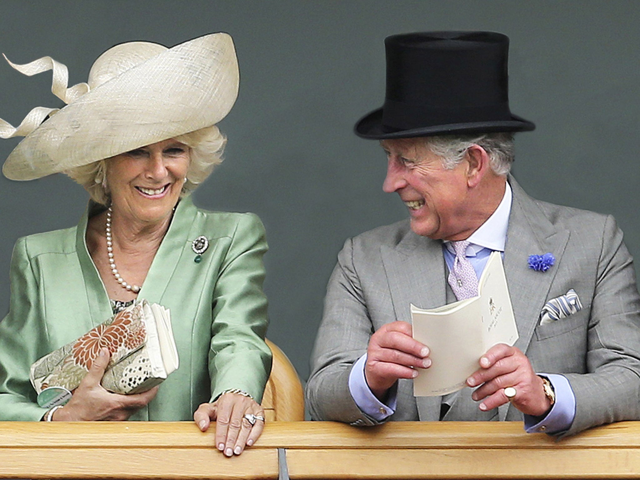 Camilla, Duchess of Cornwall and Prince Charles, Prince of Wales as they are seen viewing horses in the parade ring from the Royal Box on the second day of Royal Ascot in London, 2013